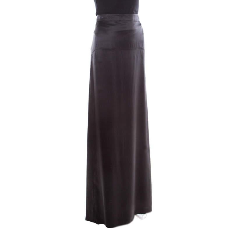 From Roberto Cavalli comes this maxi skirt crafted in a straight silhouette with flattering floor-sweeping length. It is adorned with a classic black hue and features a subtle pleat detail at the bottom rear. It is crafted from silk and will look