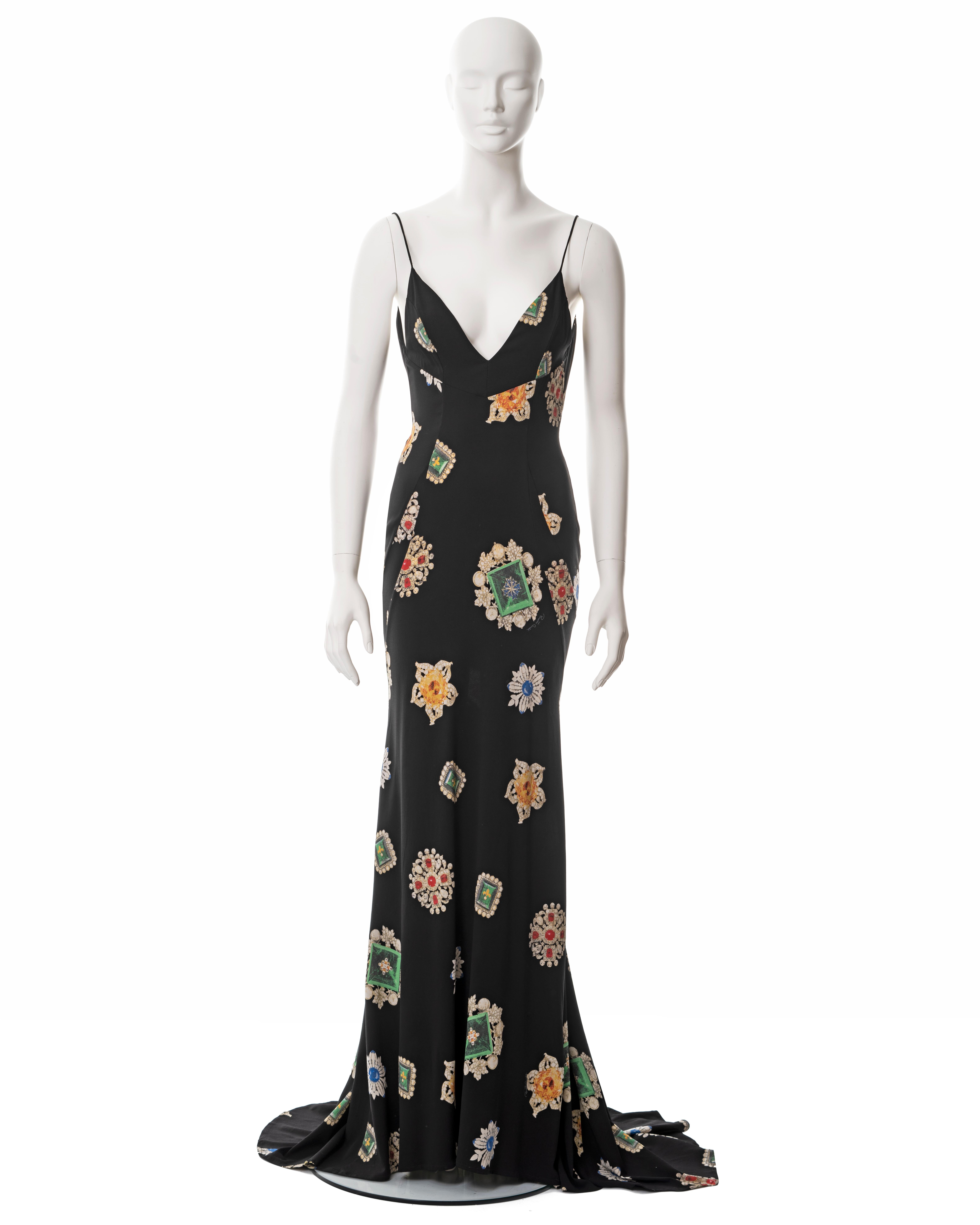 ▪ Roberto Cavalli black silk-crepe evening dress
▪ Sold by One of a Kind Archive
▪ Allover multicoloured jewel print 
▪ Plunging neckline 
▪ Floor-length skirt with train and dancing loop 
▪ Size Medium
▪ Made in Italy

All photographs in this