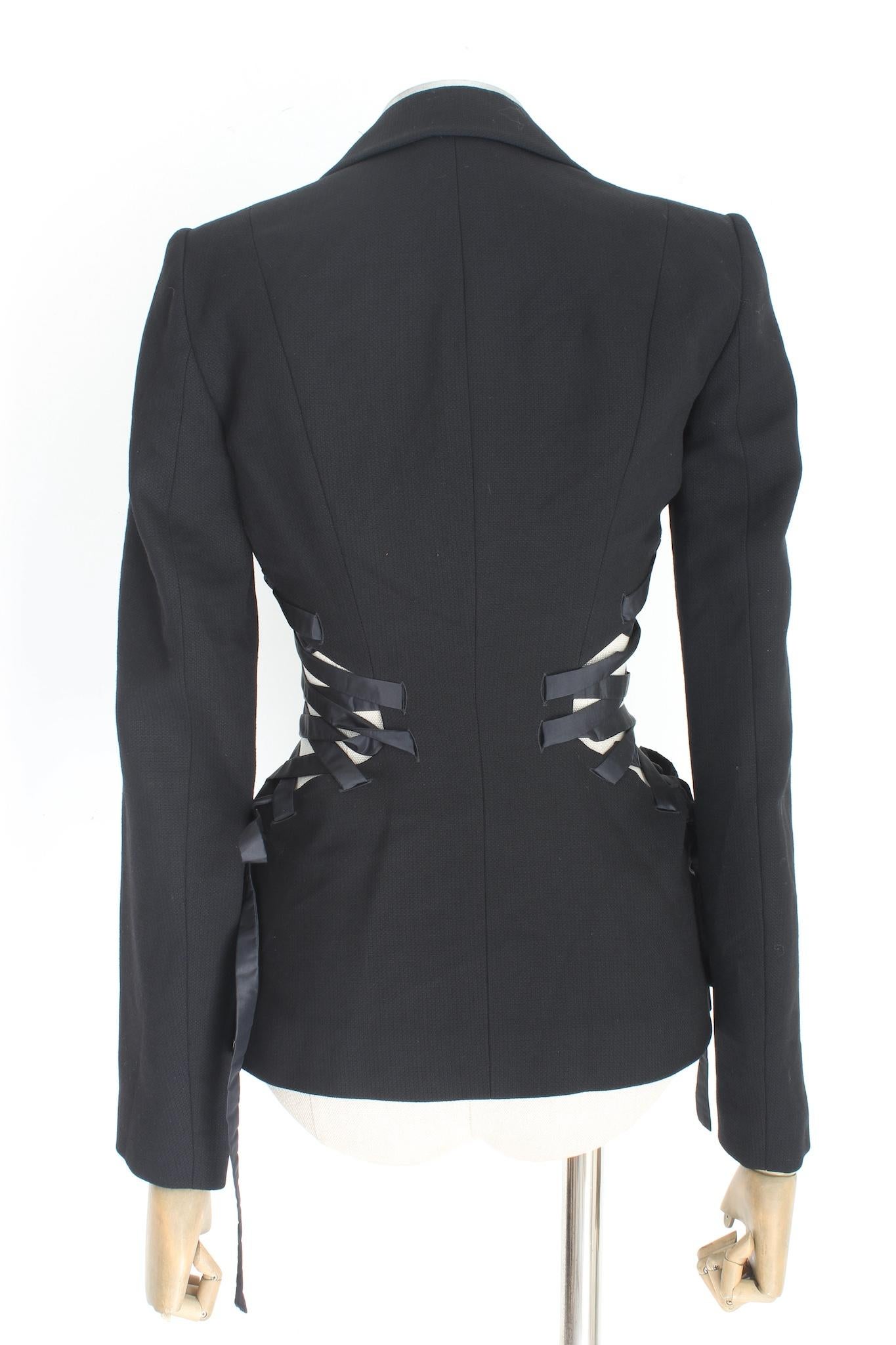 Roberto Cavalli elegant 2000s jacket. Black blazer, slim fit with luxurious silk details on the sides, which make the jacket special for a glamorous evening. Lapel in silk. 35% viscose, 65% wool fabric, internally lined. Made in Italy.

Size: