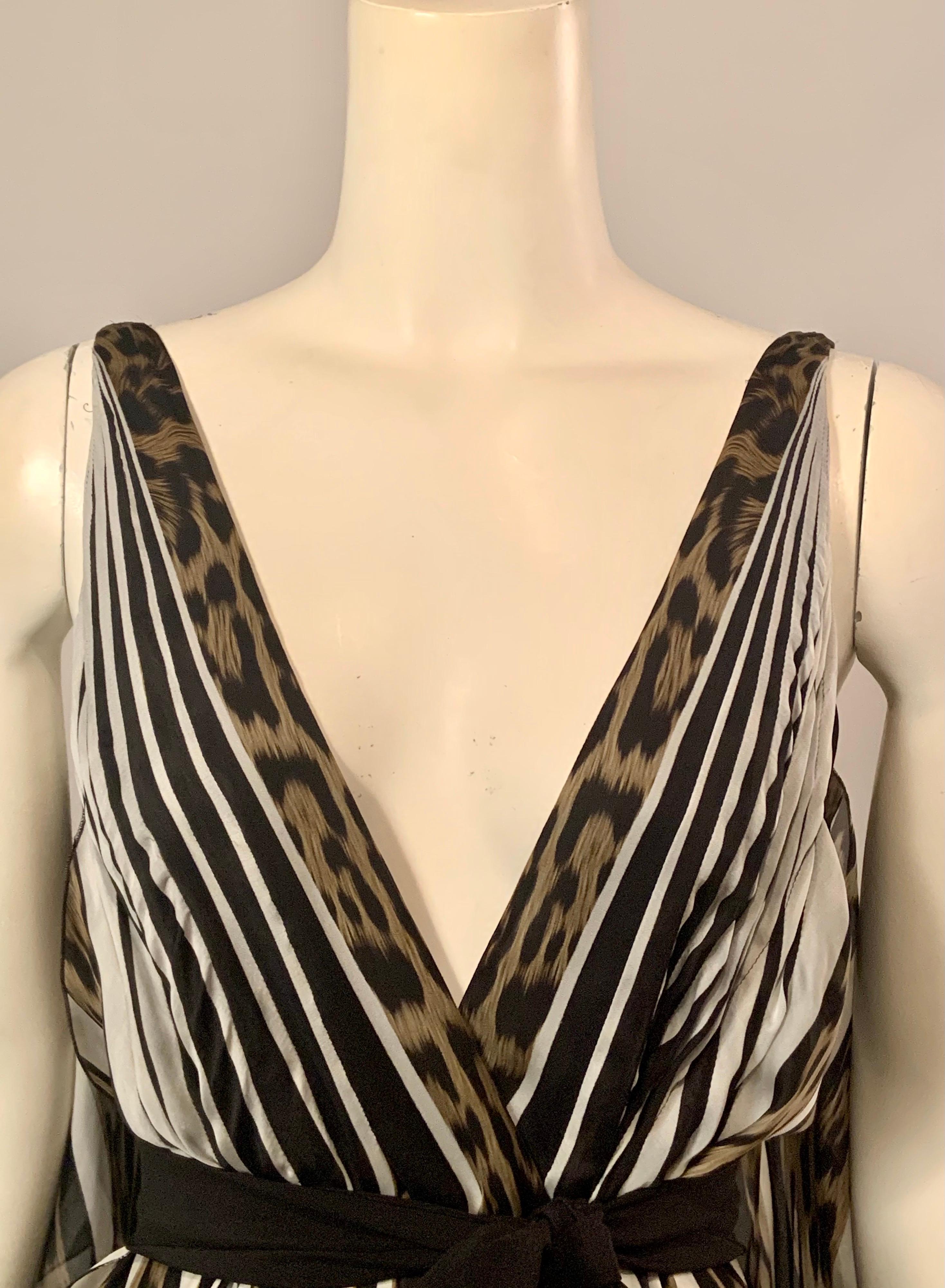 This gorgeous silk chiffon dress just slips on over your head and fastens with one interior tie and one snap. The optional black silk sash slips through openings on both sides of the back dress panel and ties at the center front. The silk chiffon is