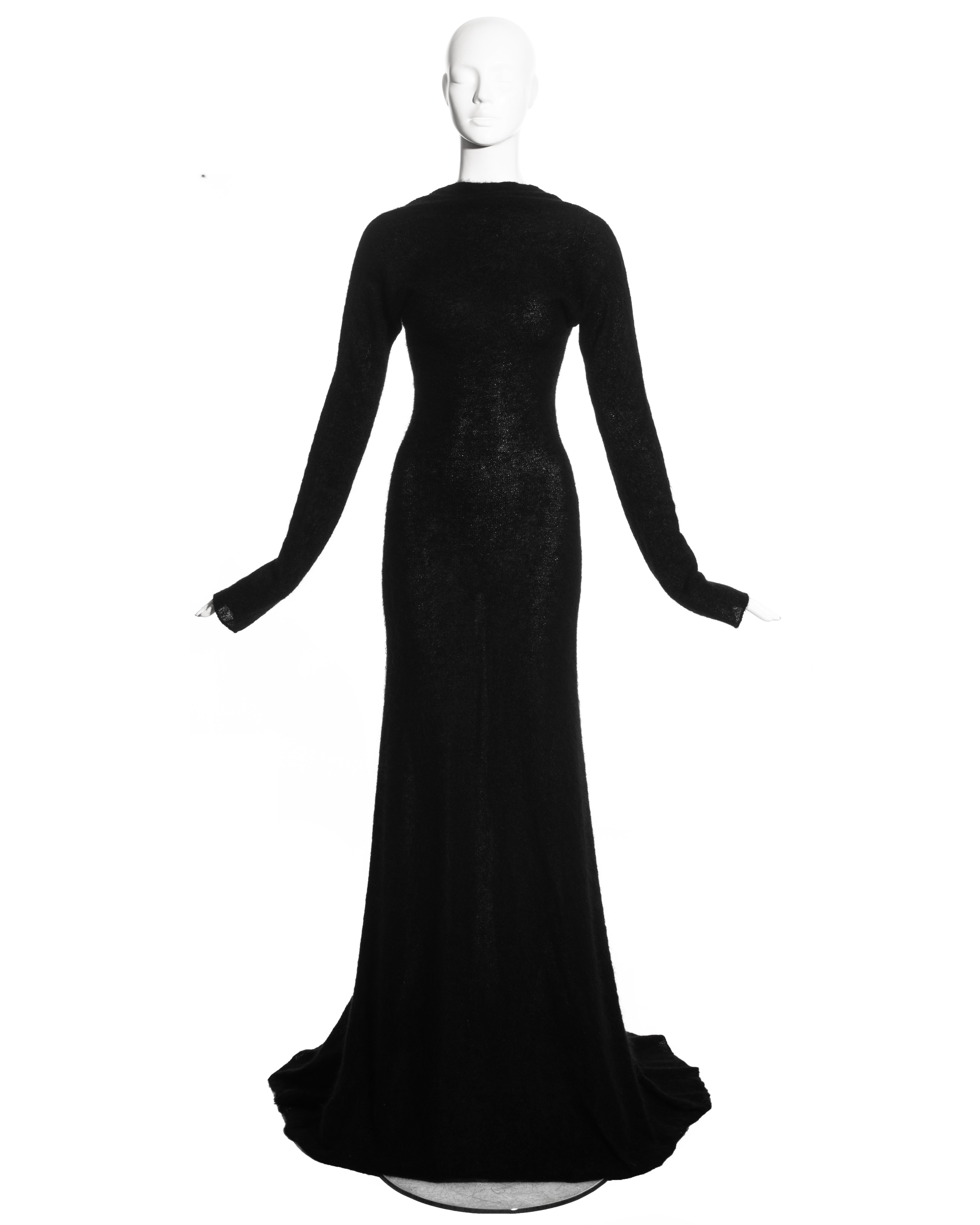 Roberto Cavalli black wool low back trained evening dress with draped neckline.

c. 2000s