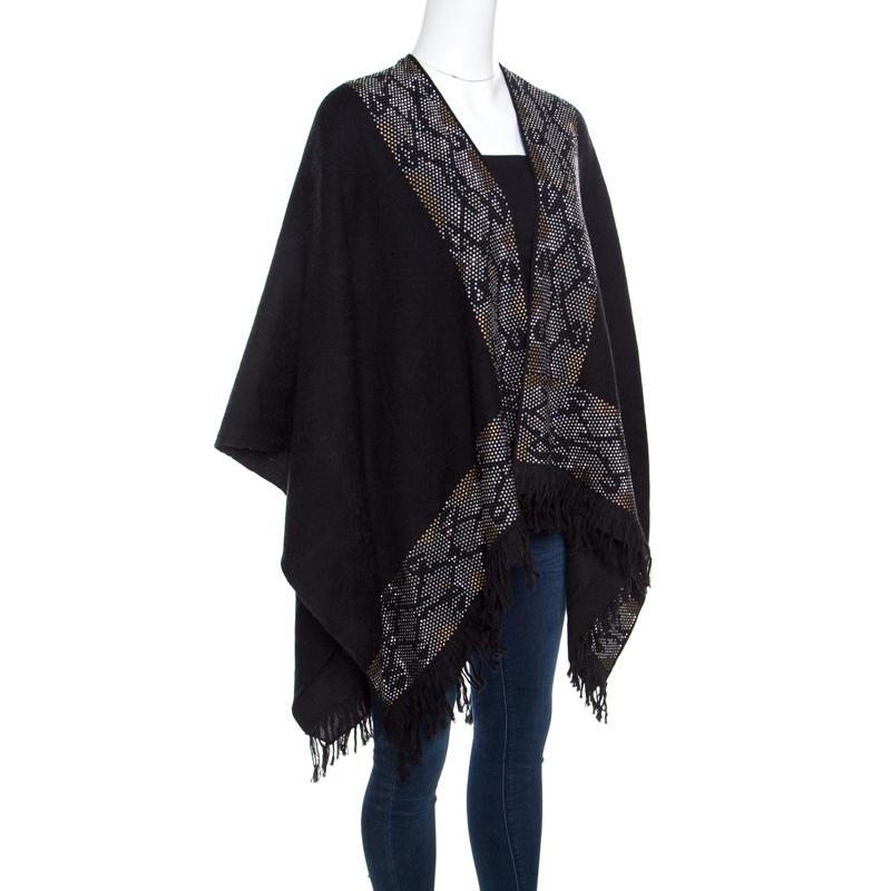 The smooth black hue and printed edges of this Roberto Cavalli poncho echo label's penchant for edgy styles forming a stylish layer to wear for the new season and beyond. It is styled with fringed edges in an open front style. Drape it over your
