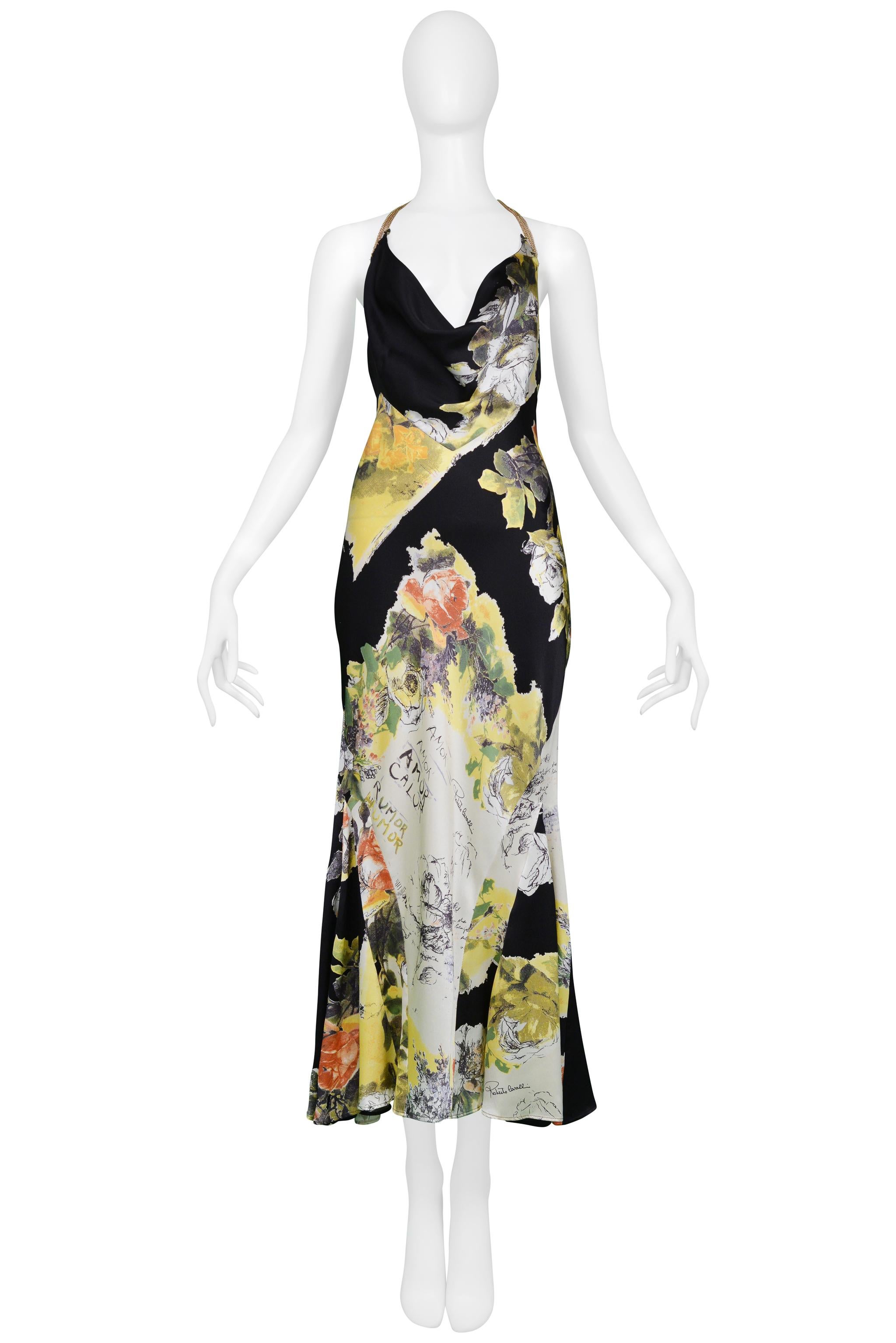 Resurrection Vintage is excited to present a vintage Roberto Cavalli black yellow, and white silk slip dress with a decorative floral print featuring 