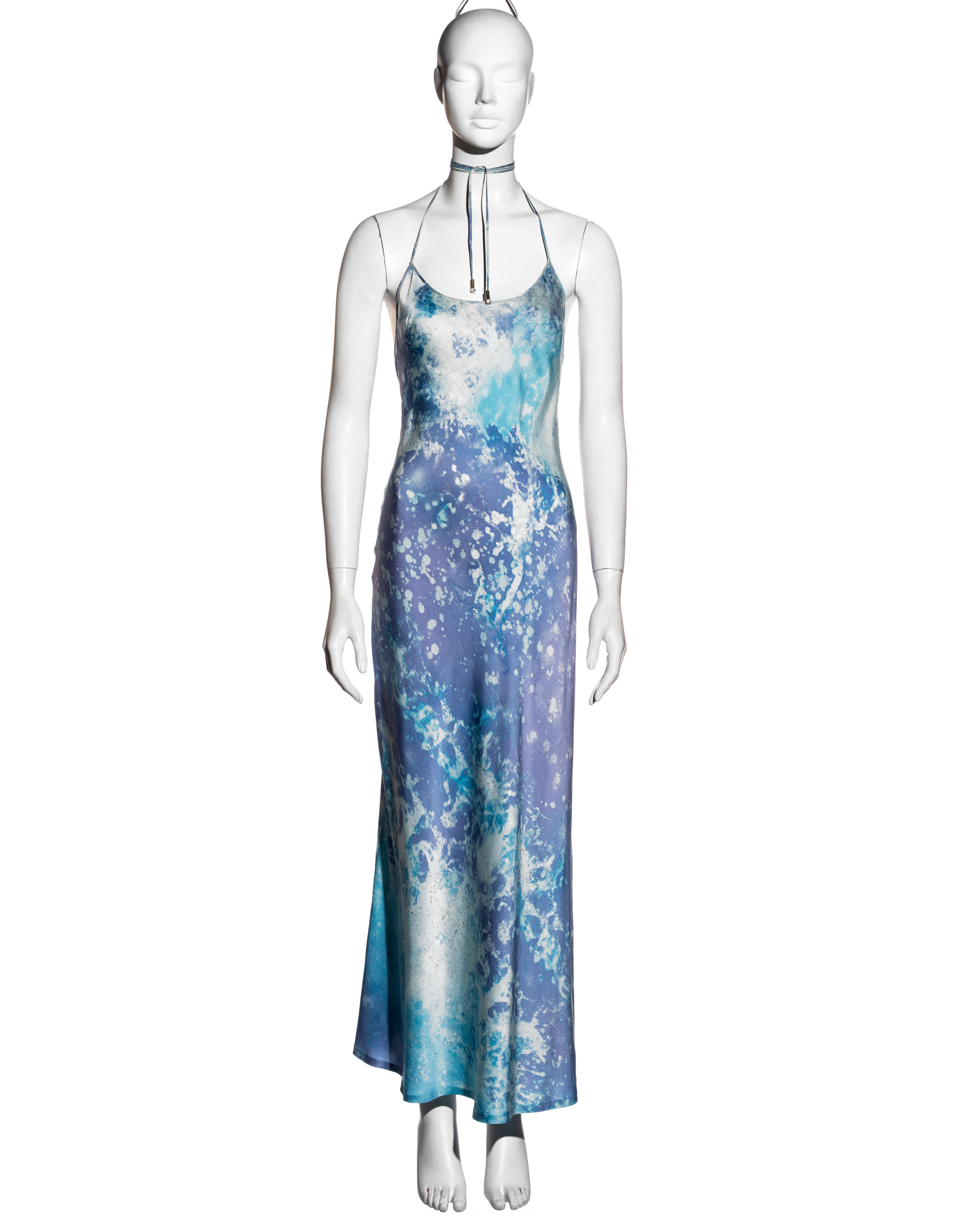 ▪ Roberto Cavalli blue and purple silk maxi dress
▪ Acid wash print with gold glitter 
▪ Scoop neck
▪ Halter ties with crystal charms 
▪ Size Medium
▪ Spring-Summer 1999
▪ 100% Silk