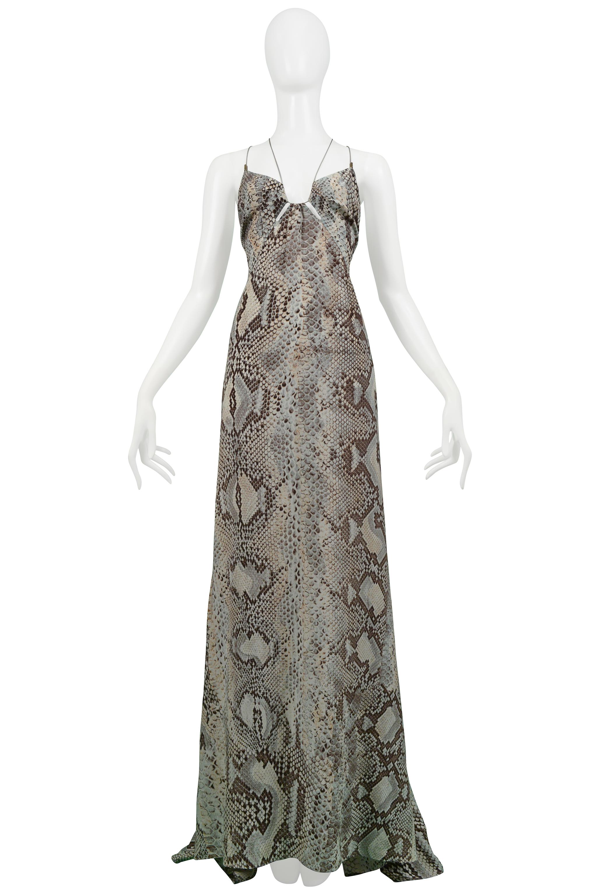 Resurrection Vintage is excited to present a vintage Roberto Cavalli blue and grey tone snake print silk evening gown featuring a cutout front bodice, cantilevered blue ties with silver spring hardware, lace up corset sides, exposed back, center