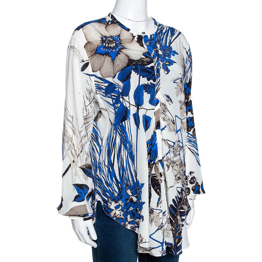 Effortlessly stylish, this Roberto Cavalli blouse is great for a day out. Crafted from pure silk, it comes in a lovely shade of blue. It has a simple round neck, long sleeves, good fit and button closure. It has a leaf print that adds interest.

