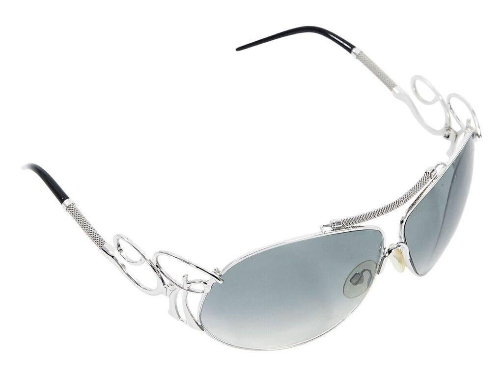 Product details:  Blue lens sunglasses by Roberto Cavalli.  Textured top bar.  Cushioned nose pads.  Gradient lenses.  Temple logo detail.  Silvertone hardware.  Original case included.  3