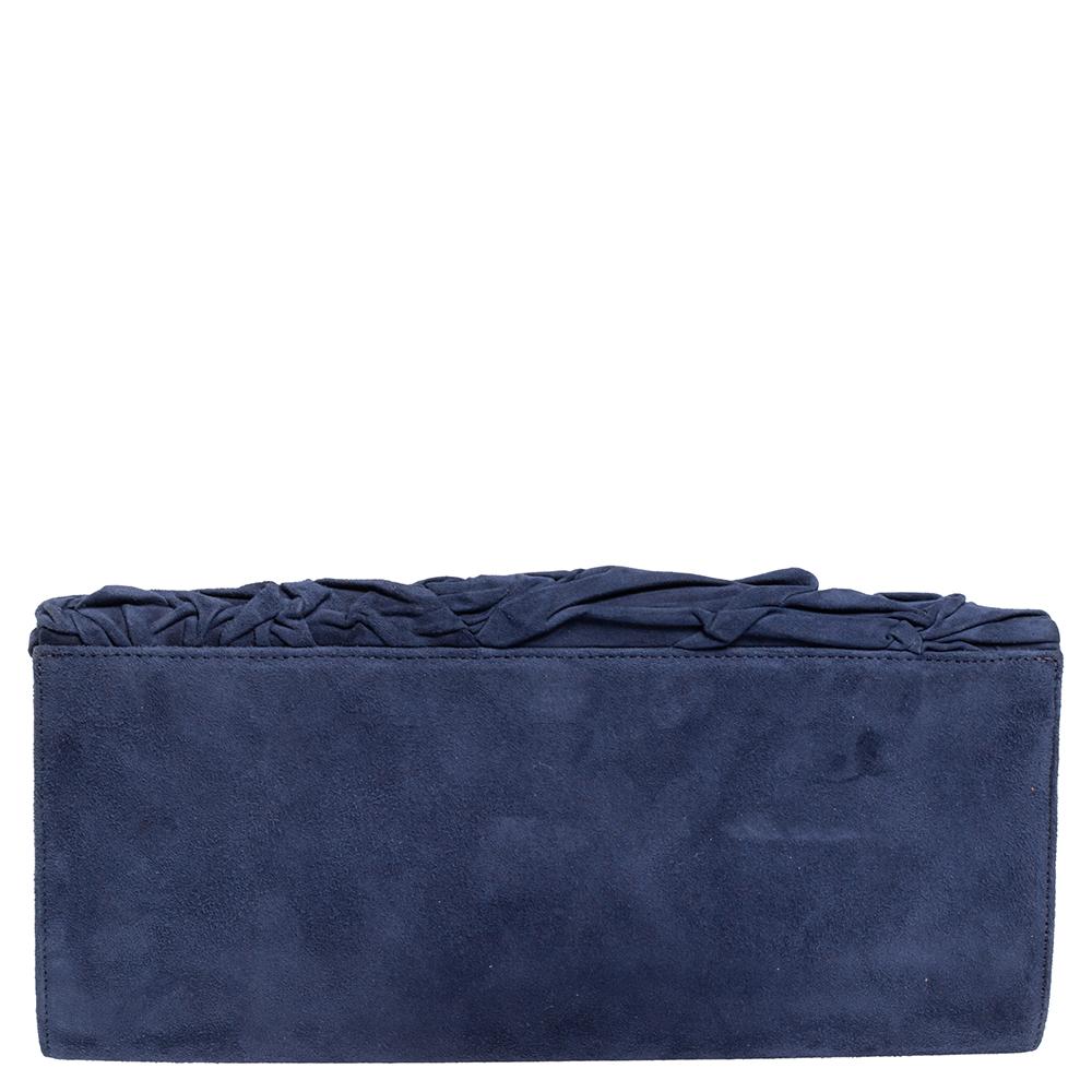 This clutch from Roberto Cavalli is designed in a blue-hued suede body. It brings a pleated exterior and the interior houses a zip pocket. It comes finished with gold-tone hardware and is perfect for evenings.

Includes: Original Dustbag, Brand Tag
