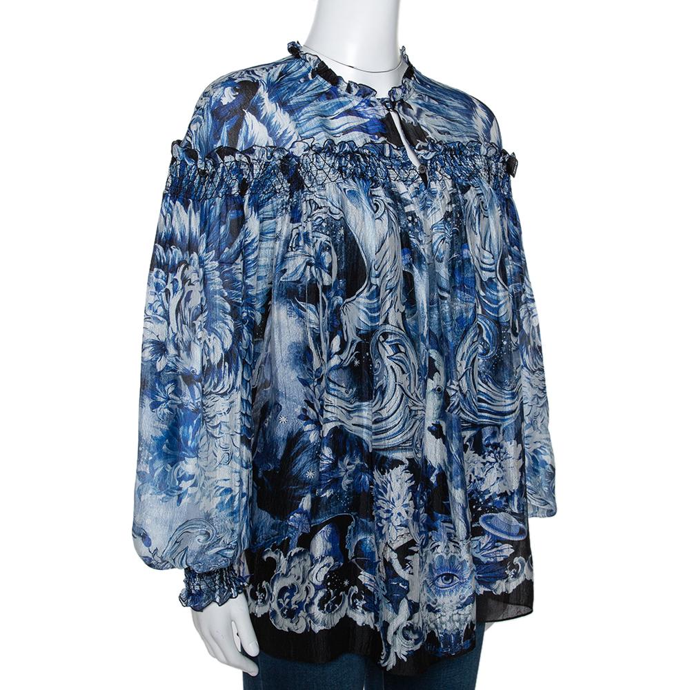 Roberto Cavalli is known to create unique prints and vibrant colors that flatter. This blouse is perfect for fun days and will lift your casual outfits instantly. Crafted from pure silk, it comes in a shade of blue and has a lovely print throughout.