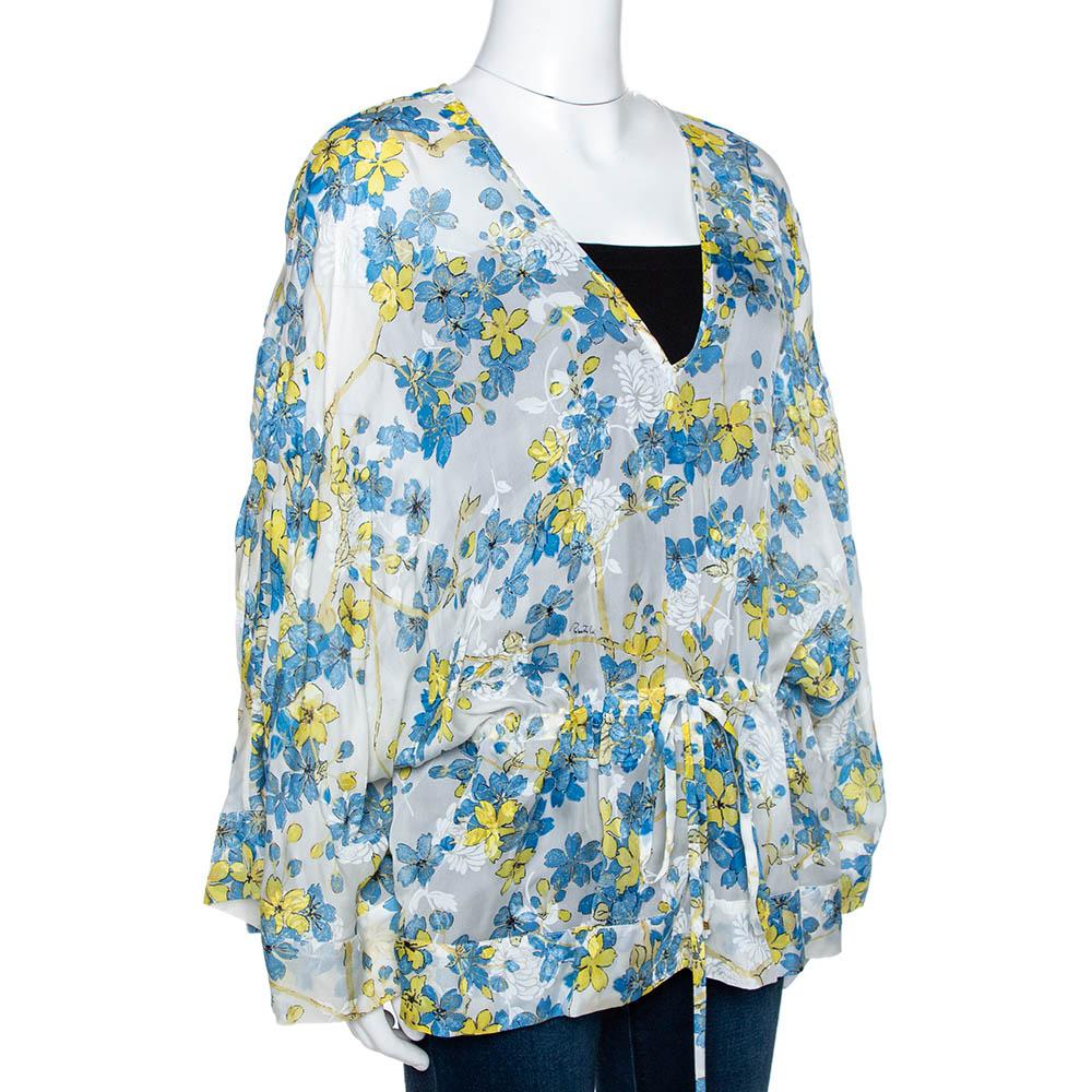 This lovely kaftan top from Roberto Cavalli is great for vacations and summers. Crafted from quality silk, it comes in a lovely shade of white & blue and flaunts a floral print throughout. it is styled with long sleeves, a deep v-neck and a belt