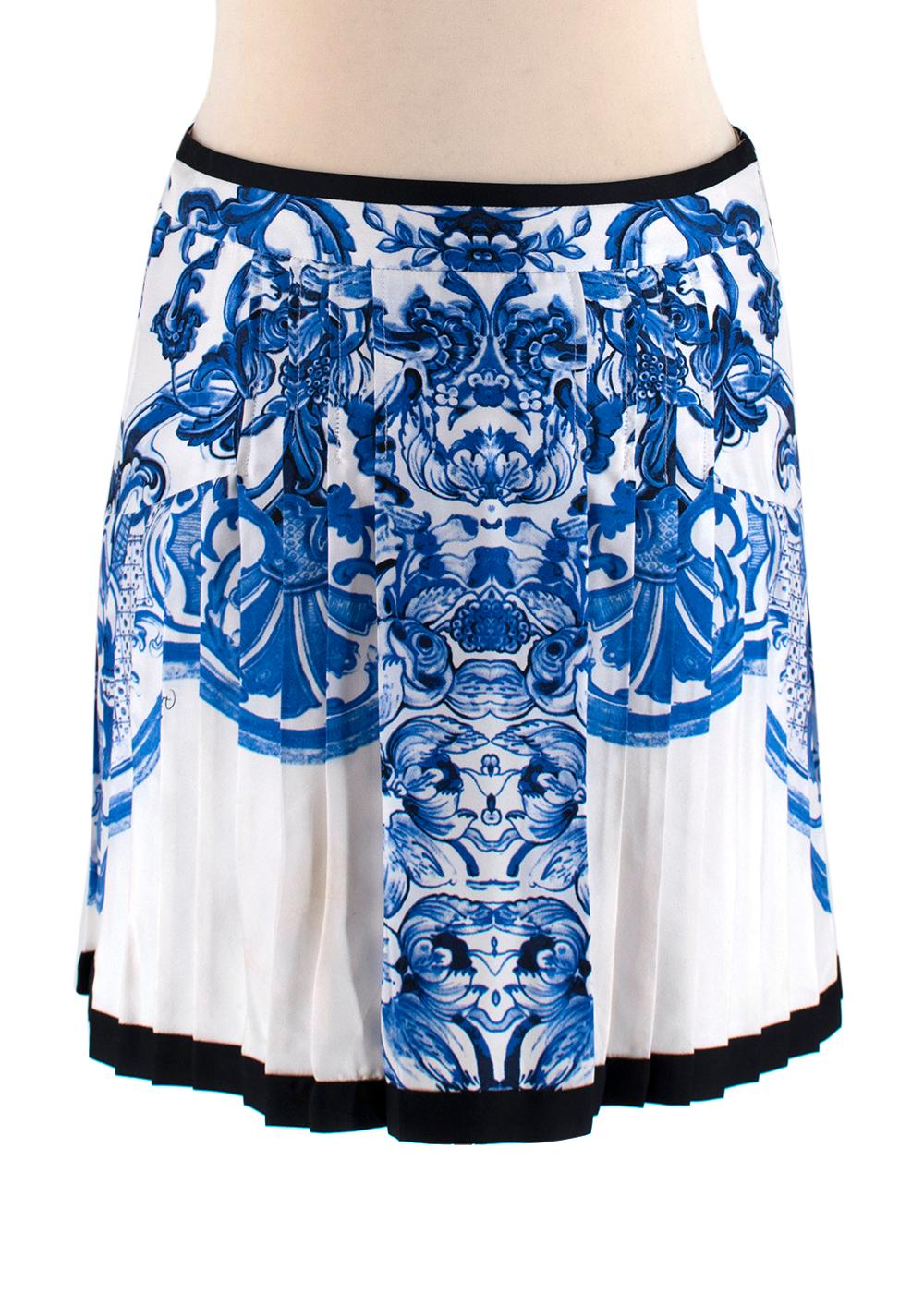 Roberto Cavalli Blue Floral Silk Shirt and Skirt Set

- Pure lightweight silk 
- Elegant blue floral design 
- Shirt features a concealed button fastening and front patch pockets 
- Pleated mini length skirt features a concealed side zip fastening