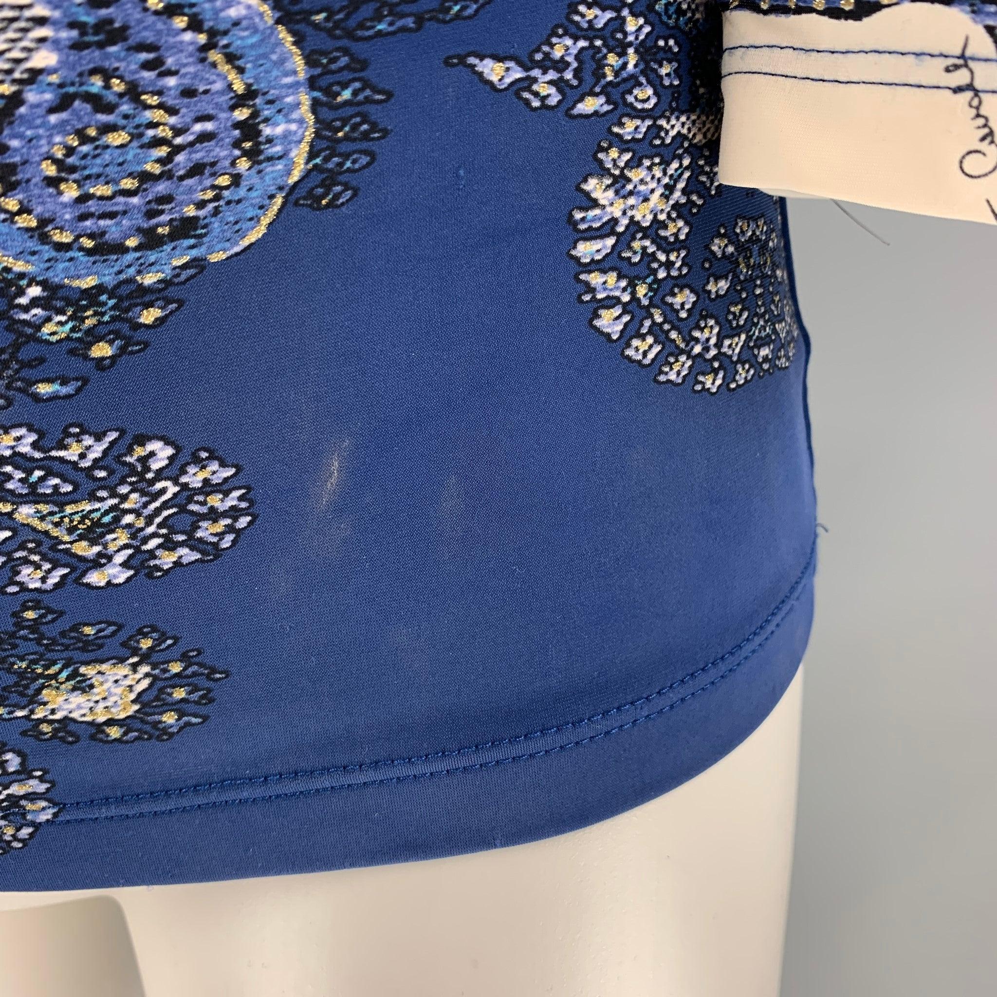 ROBERTO CAVALLI blouse comes in blue and white paisley print fabric featuring draped neckline.Good Pre-Owned Condition.
Fabric Tag Removed and marks at bottom front and left side seam. 

Marked:   Size Tag Removed. 

Measurements: 
 
Shoulder: 17