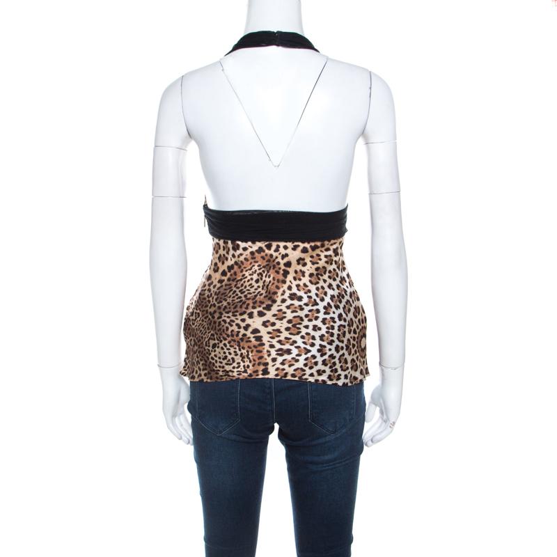 Designed to help you stand out, this halter top from Roberto Cavalli is a must have! The brown creation is made of 100% silk and features a flattering silhouette. It flaunts a trendy cheetah print and comes equipped with hook fastenings.

Includes: