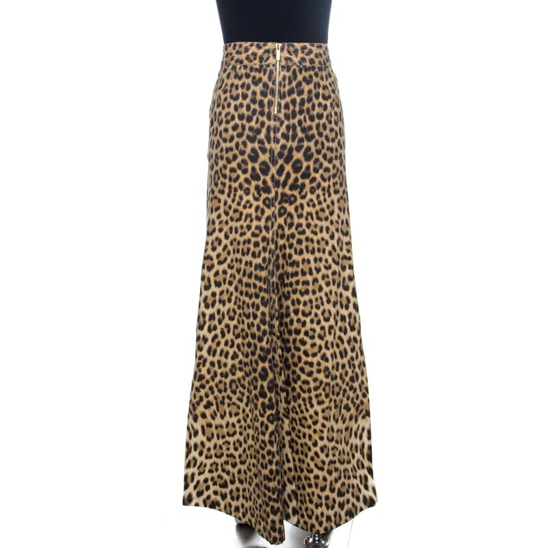 This stylish maxi skirt comes from the house of Roberto Cavalli. It has been crafted from a cotton blend and comes in a lovely brown color. It features a leopard print throughout that adds interest. It has a zip closure, a-line silhouette and a good