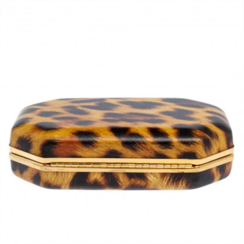 Presenting a finely-made clutch to go with your evening looks! Designed by Roberto Cavalli, the clutch has a leopard-printed leather exterior with a gold-tone frame and a single handle. The leather-lined interior has ample space for your party