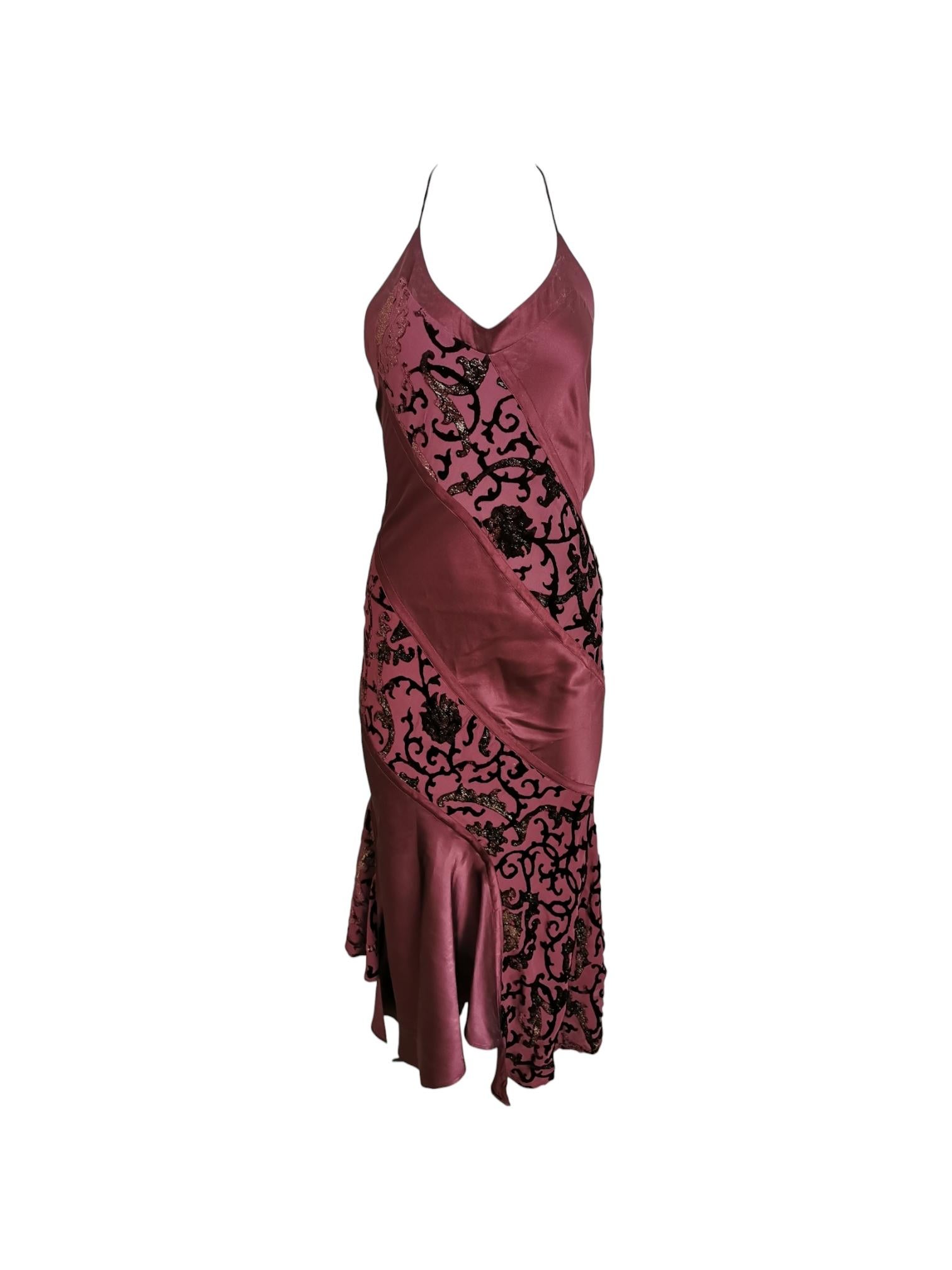 Roberto Cavalli burgundy slip dress with a decorative floral flocking print featuring thin straps, a slip dress style bodice, and a flared hem. 

Material: Silk and satin

Size: Small

Condition: Good however please note there is some white