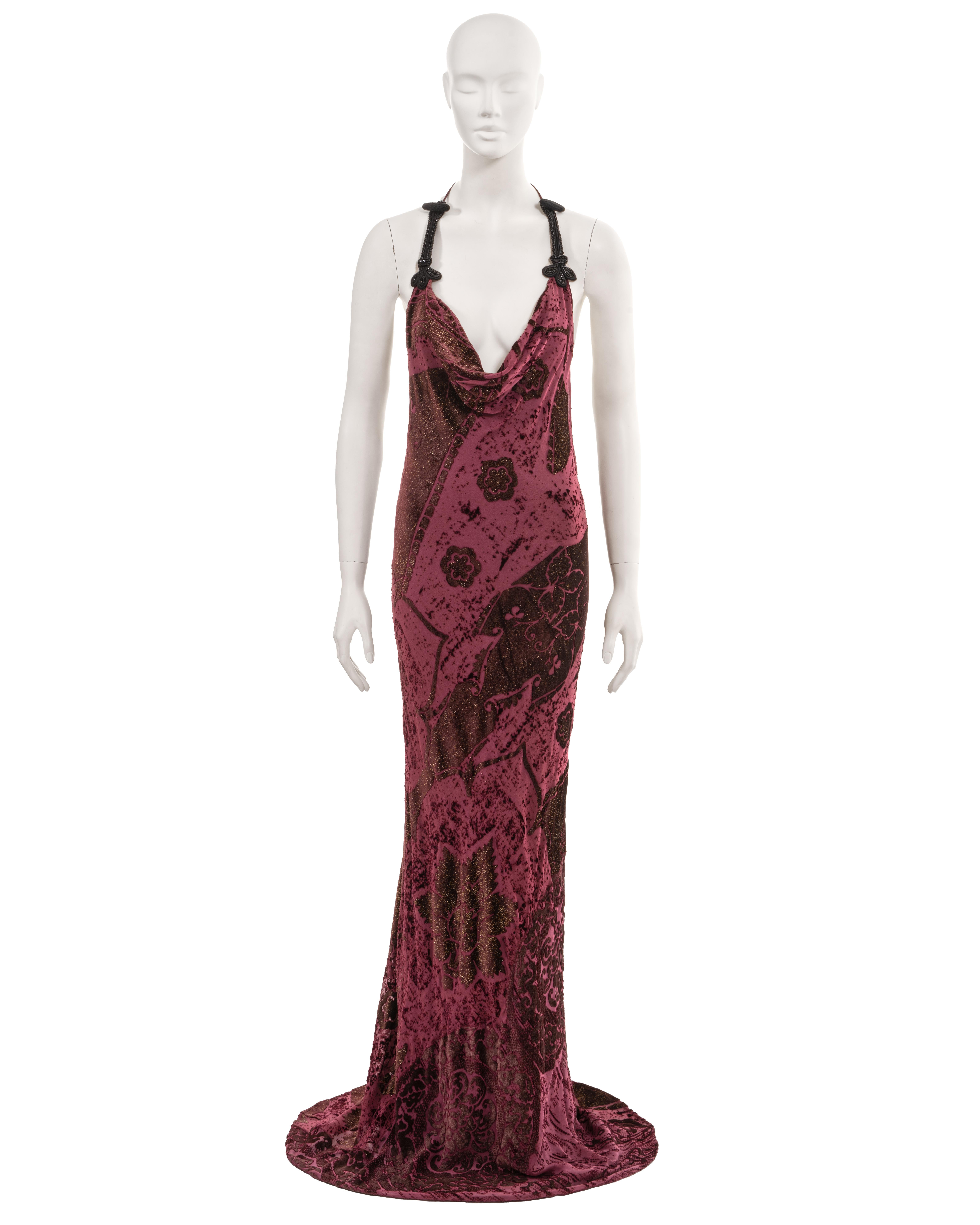 ▪ Roberto Cavalli halter neck evening dress
▪ Fall-Winter 2004
▪ Sold by One of a Kind Archive
▪ Burgundy silk-rayon cut-velvet with metallic gold flecking
▪ Plunging cowl neck 
▪ Halterneck string ties with decorative beaded frog-fastening detail
▪