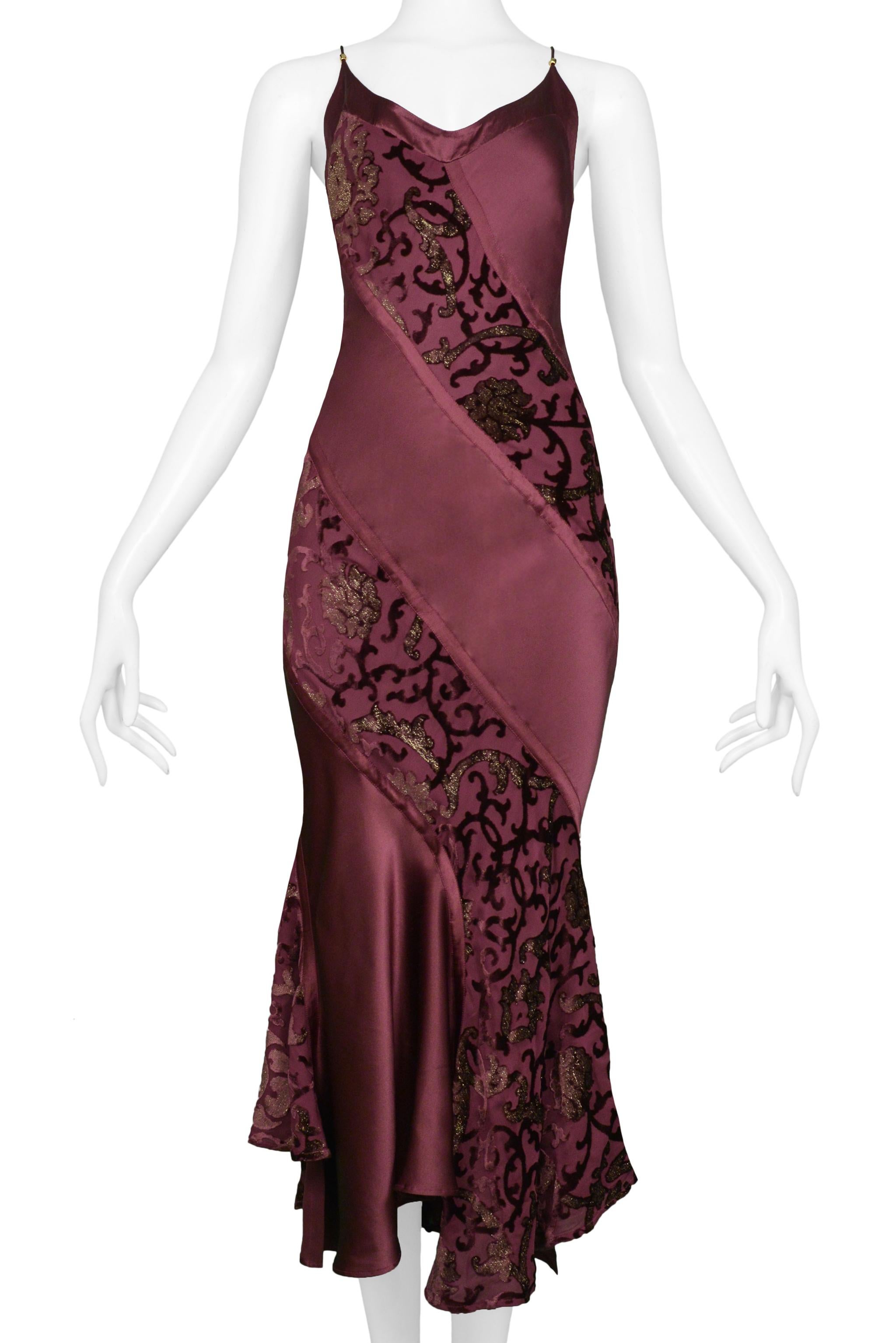 Resurrection Vintage is excited to present a vintage Roberto Cavalli burgundy slip dress with a decorative floral flocking print featuring thin straps, a slip dress style bodice, and a flared hem. 

Roberto Cavalli
Size: Small
Silk and