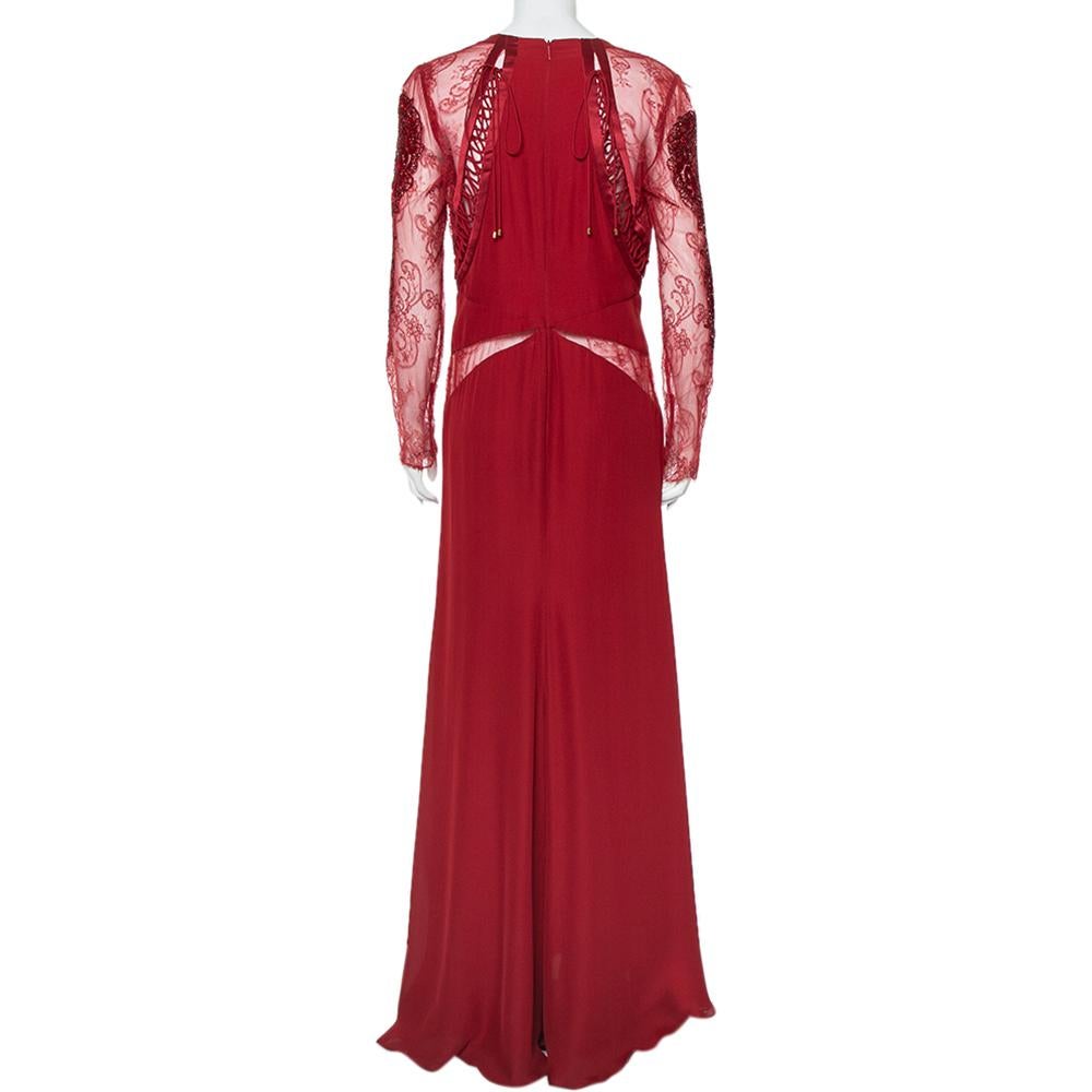 The search for the perfect dress ends with this gorgeous maxi number from Roberto Cavalli! The burgundy creation is made of silk and features a flattering faux wrap silhouette. It flaunts a V-neckline and artistically designed embellished lace