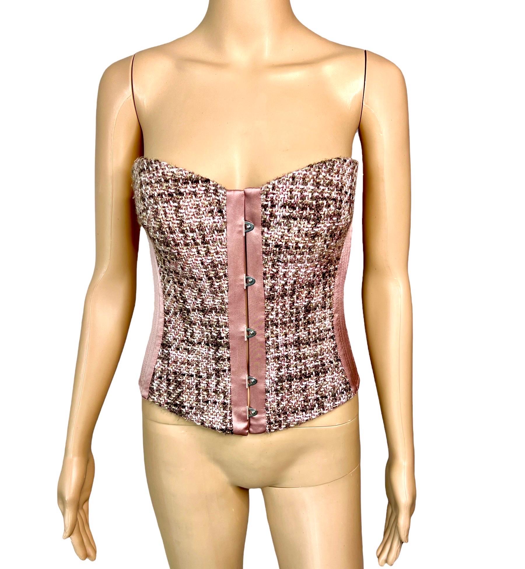 Roberto Cavalli c.2005 Bustier Tweed Satin Lace Up Corset Top IT 42

Roberto Cavalli structured boned corset top featuring tweed and satin panels, hook eye closure in front, and lace up back with gold tone eyelets. 