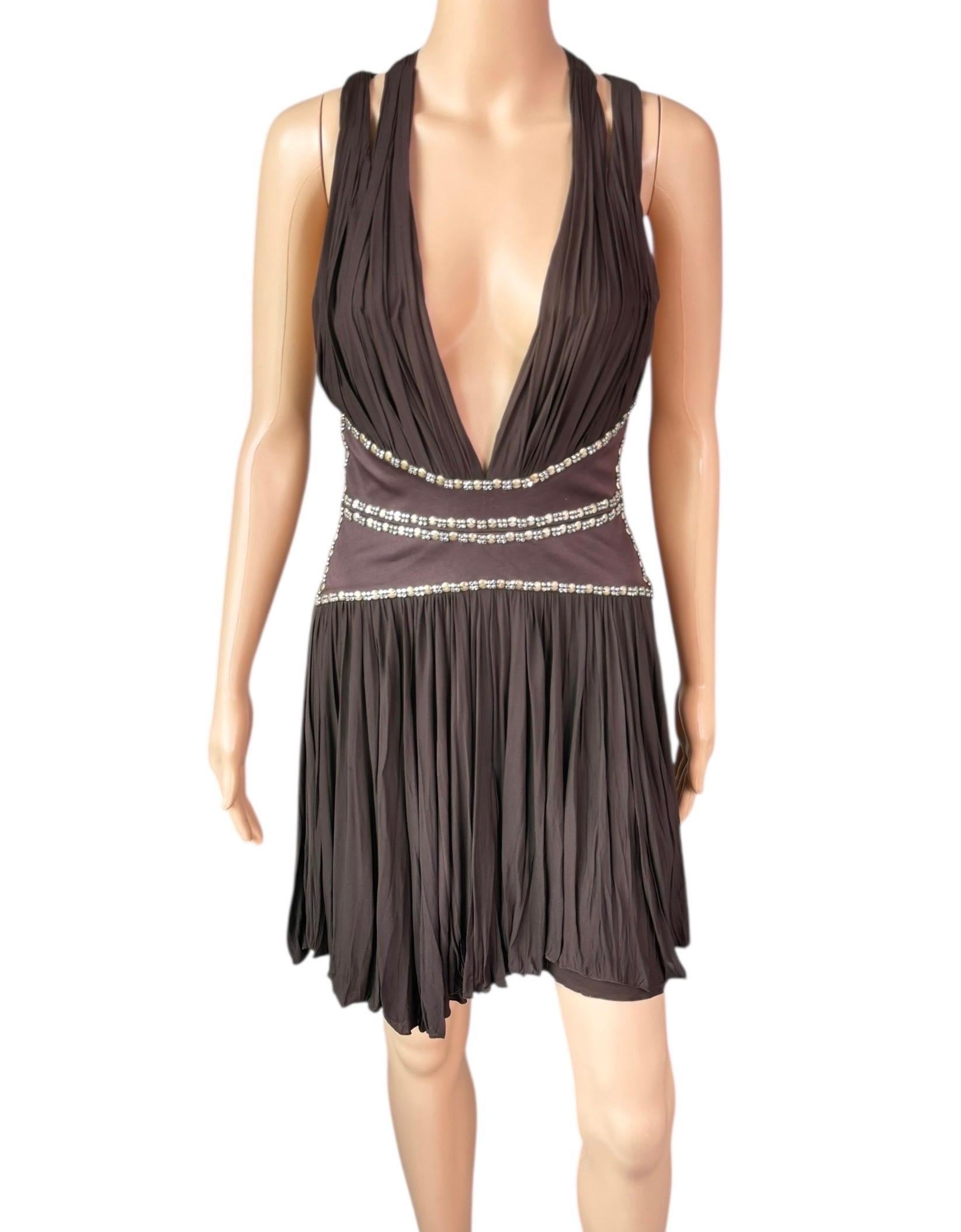 Roberto Cavalli c.2008 Minivestido marrón con escote pronunciado y recorte adornado

Talla IT 40

Estado: muy buen estado de segunda mano