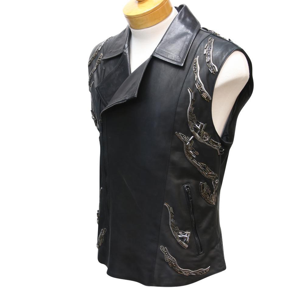 Roberto Cavalli Calfskin Moto Embellished Leather Vest Jacket

Roberto Cavalli Motorcycle style biker vest in a soft smooth black leather and features a double breasted zip closure, pointed lapels, zip pockets with black pulls, and embellished on