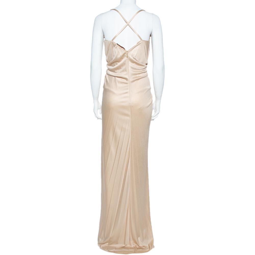 Be the talk of the town and catch admiring glances from a mile every time you don this special creation by Roberto Cavalli. This gown is for an evening where you want to shine bright and dazzle. Crafted to deliver sensual style, it has been made