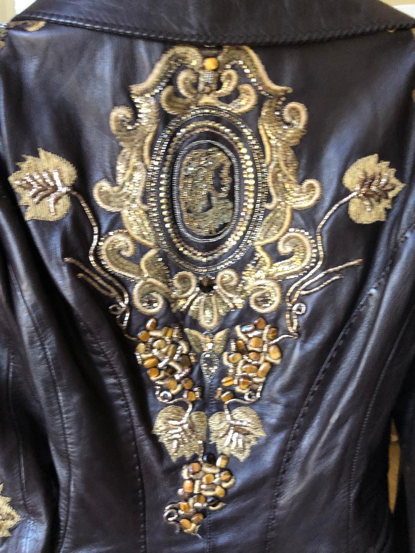Roberto Cavalli Collectable Embellished Whipstitch Black Leather Jacket with Tigereye 
Please use the zoom feature to see all the great details.
From late 1980's  this is amazing
Size M
  Bust 38