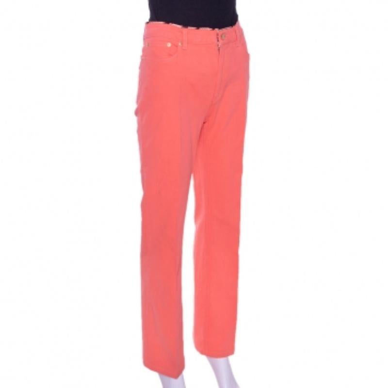 These Roberto Cavalli jeans are stylish and playful. Crafted from cotton, these denim jeans come in a  lovely shade of coral pink. They are styled with a zip closure, five pockets, logo plaque detailing and a tailored fit. They are great for casual