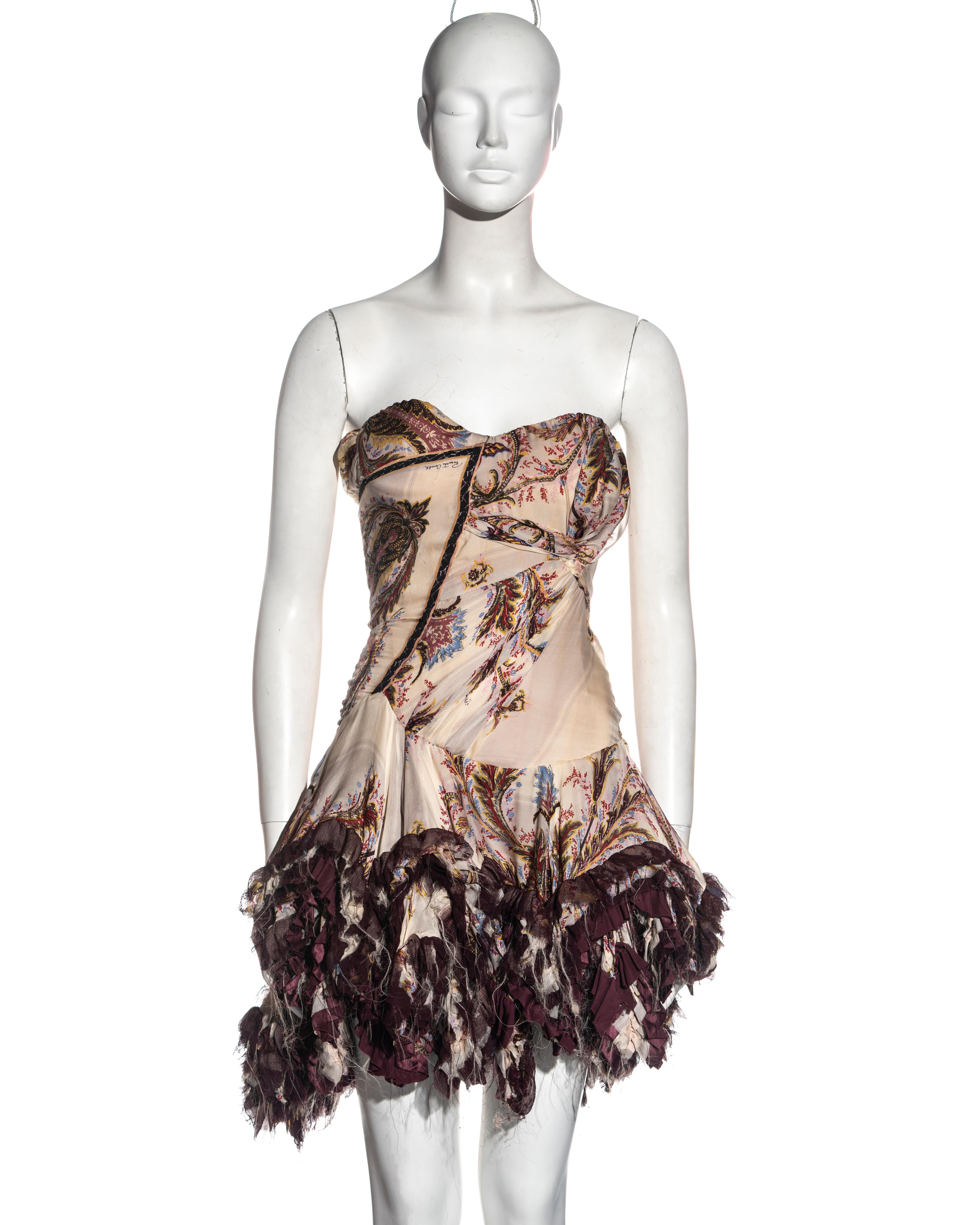 ▪ Roberto Cavalli silk corseted strapless mini dress 
▪ cream, purple and metallic gold brocade printed silk  
▪ Corseted bodice with asymmetric ruching and tucking
▪ Ruffled mini skirt with frayed hem  
▪ Corset lace-up fastening at the back  
▪