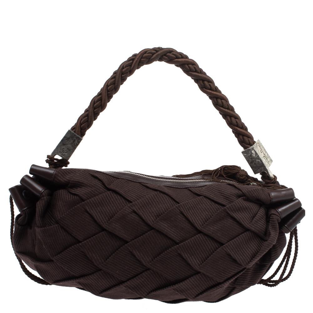 Crafted from pleated fabric and leather in Italy, this spacious hobo from Roberto Cavalli features a braided handle and a fabric interior sized to carry all your essentials. The dark brown bag is finished with strings of tassels.

