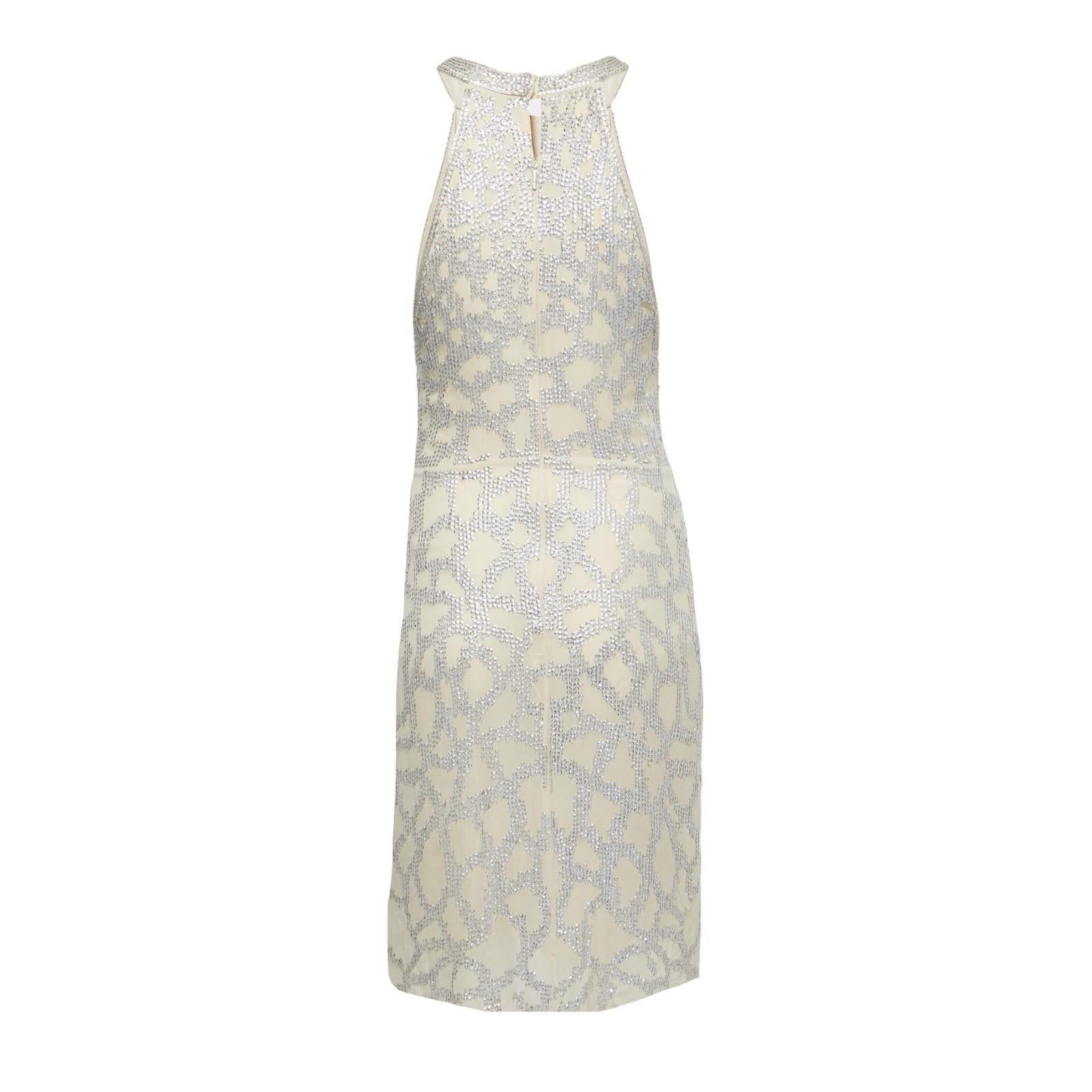 Head-turning dress by Roberto Cavalli
Wonderful silk embroidered with sequins
Zipper signed „Roberto Cavalli“
Peek-a-boo neckline 
Draped „knot“ detail in front 
Closes with zipper in back
Made in Italy
Dry Clean Only
Size 40