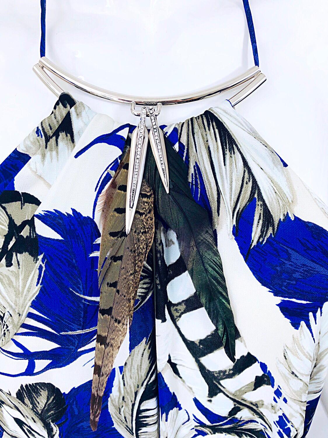 Sexy late 90s vintage ROBERTO CAVALLI feathers and rhinestones viscose jersey handkerchief hem halter dress! Features bright cobalt blue mixed with white and black throughout. Real feathers at center neck with silver rhinestone encrusted pendants at