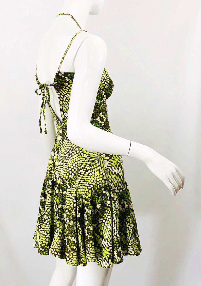 Sexy early 2000s ROBERTO CAVALLI neon green, black and white reptile print. Flirty skater style with a slight drop waist. Brass metal loop at center bust. Ties at center back to accomodate an array of bust sizes. Soft Cotton (89%) and Elastane (11%)