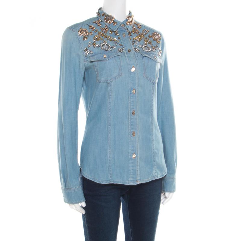 Ditch those boring and regular shirts and get your hands on this fabulous denim shirt from Roberto Cavalli. This faded effect shirt is made of 100% cotton and features stone embellishments, front button fastening and long sleeves. Pair it with smart