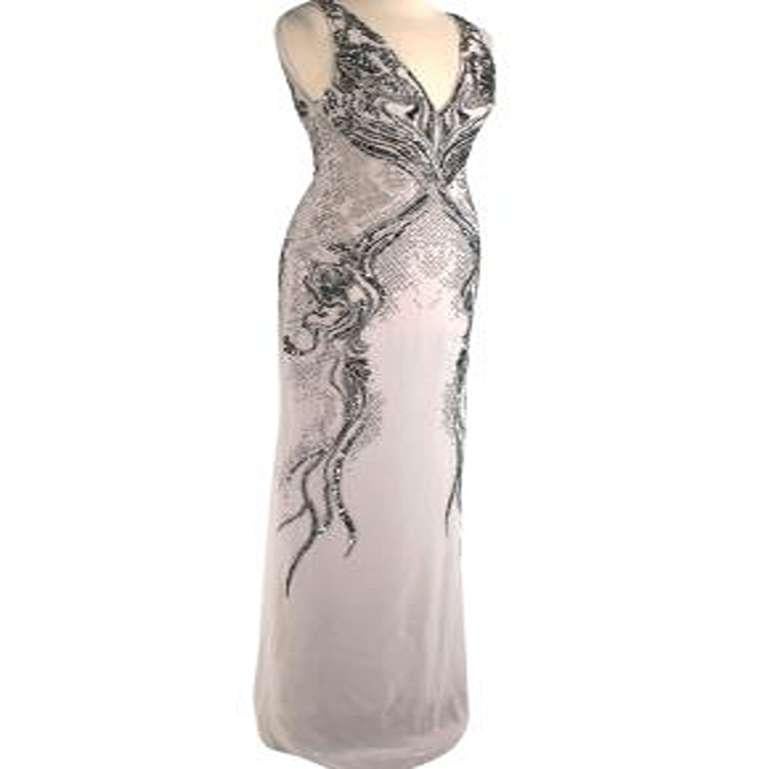 Roberto Cavalli Embellished Silk Sleeveless Gown

- Gown Length 
- Sleeveless
- Champagne Beige colour
- Embellished all over with sequins and beads
- Cutout detail

Made in India.
Dry clean only.
Condition 9.5/10. Fantastic condition, some light