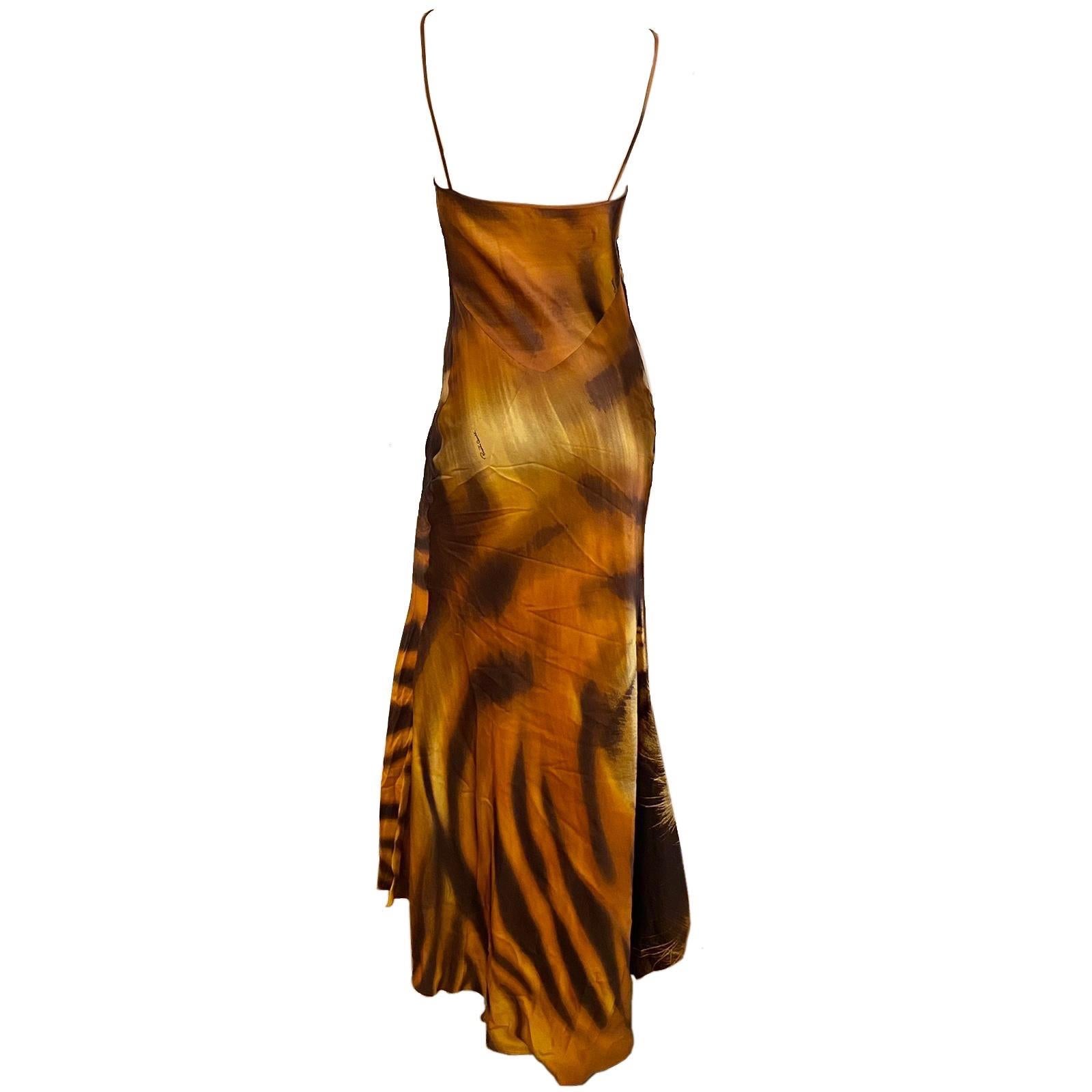 Roberto Cavalli orange Tiger Print Evening Gown from the Fall/Winter 2000 collection. Bias cut with spaghetti strap and back train. Also seen on runway and more famously on Cindy Crawford in Rome for “Donna Sotto le Stelle”, 2000.

Size S
Total