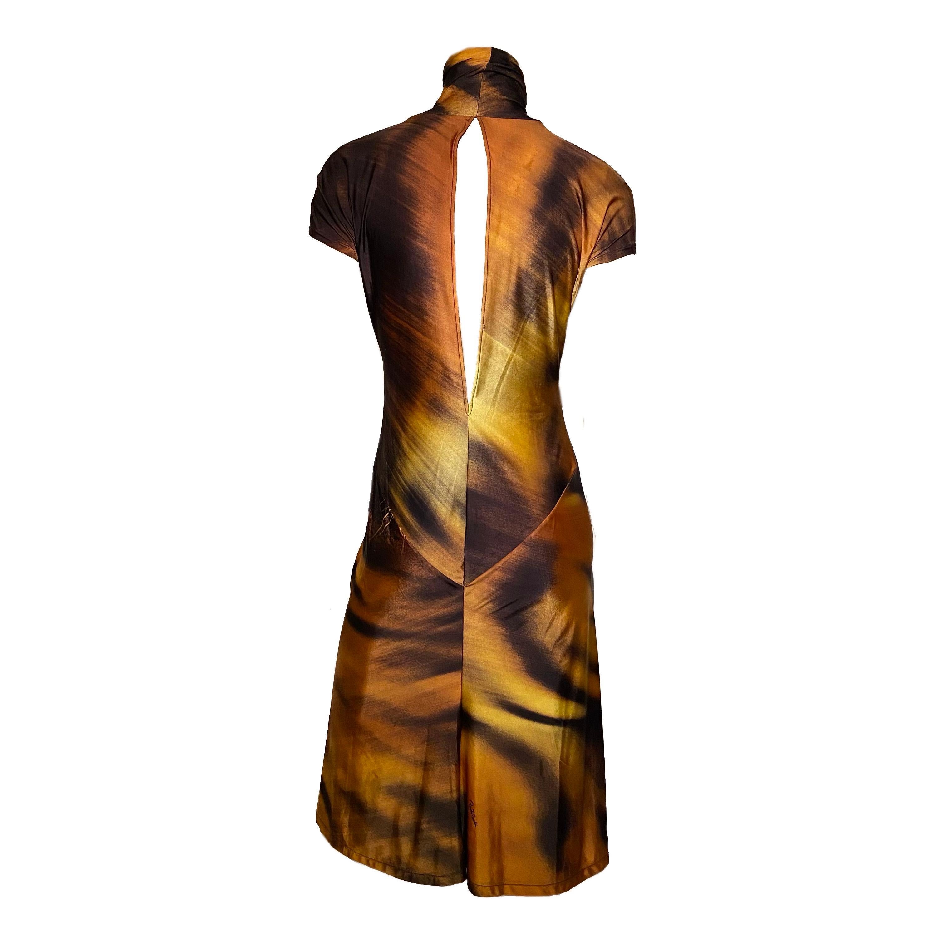 Roberto Cavalli knee-length turtleneck dress with back cut-out detail and black/orange tiger print from Fall/Winter 2000 collection.

Label removed, stretchy fabric (fits S up to bigger sizes) 

total length: 104 cm/ 40,9 inch 
bust: 84 cm/ 33 inch