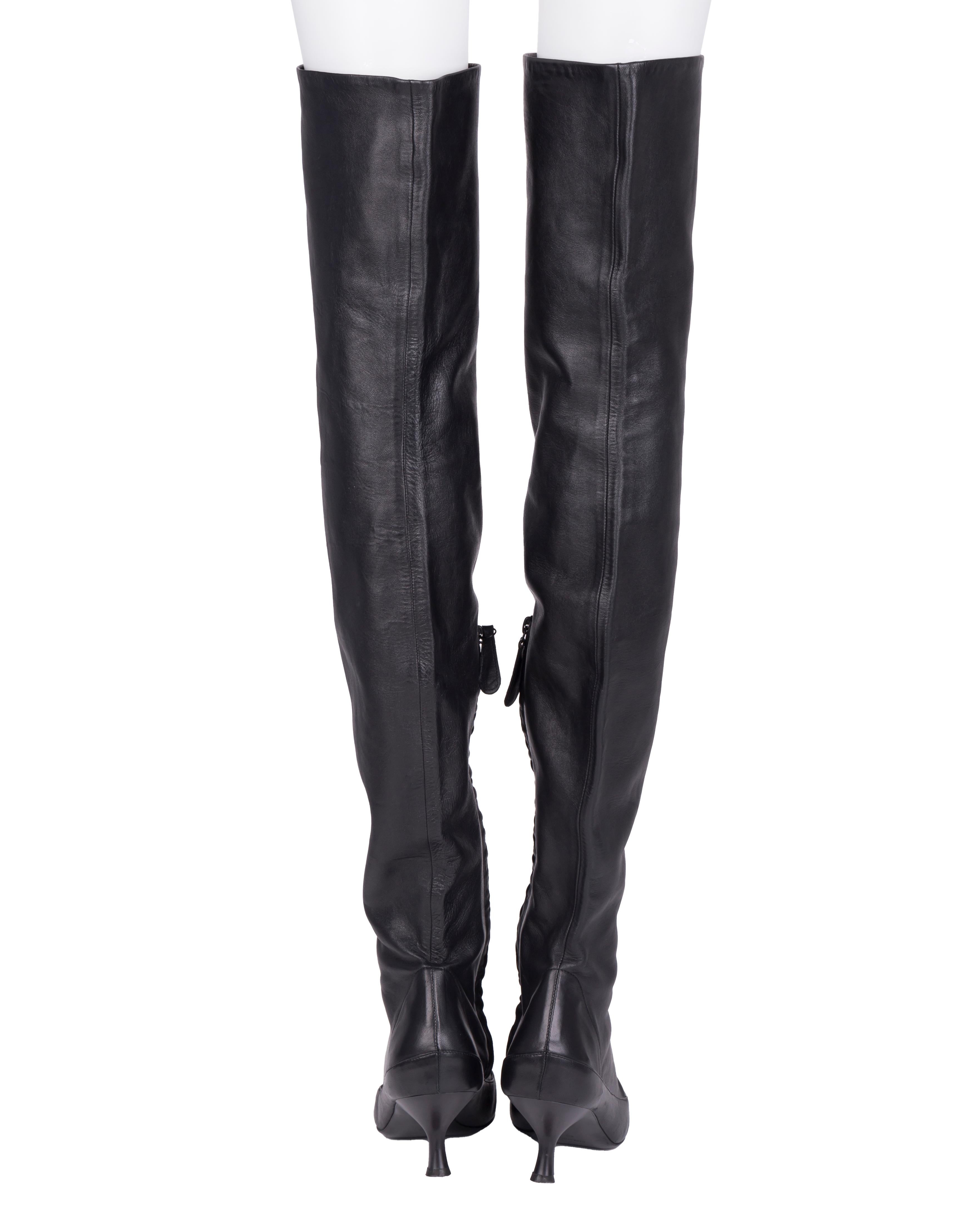 - Black thigh high soft leather boots
- Kitten heel
- Size EU 40
