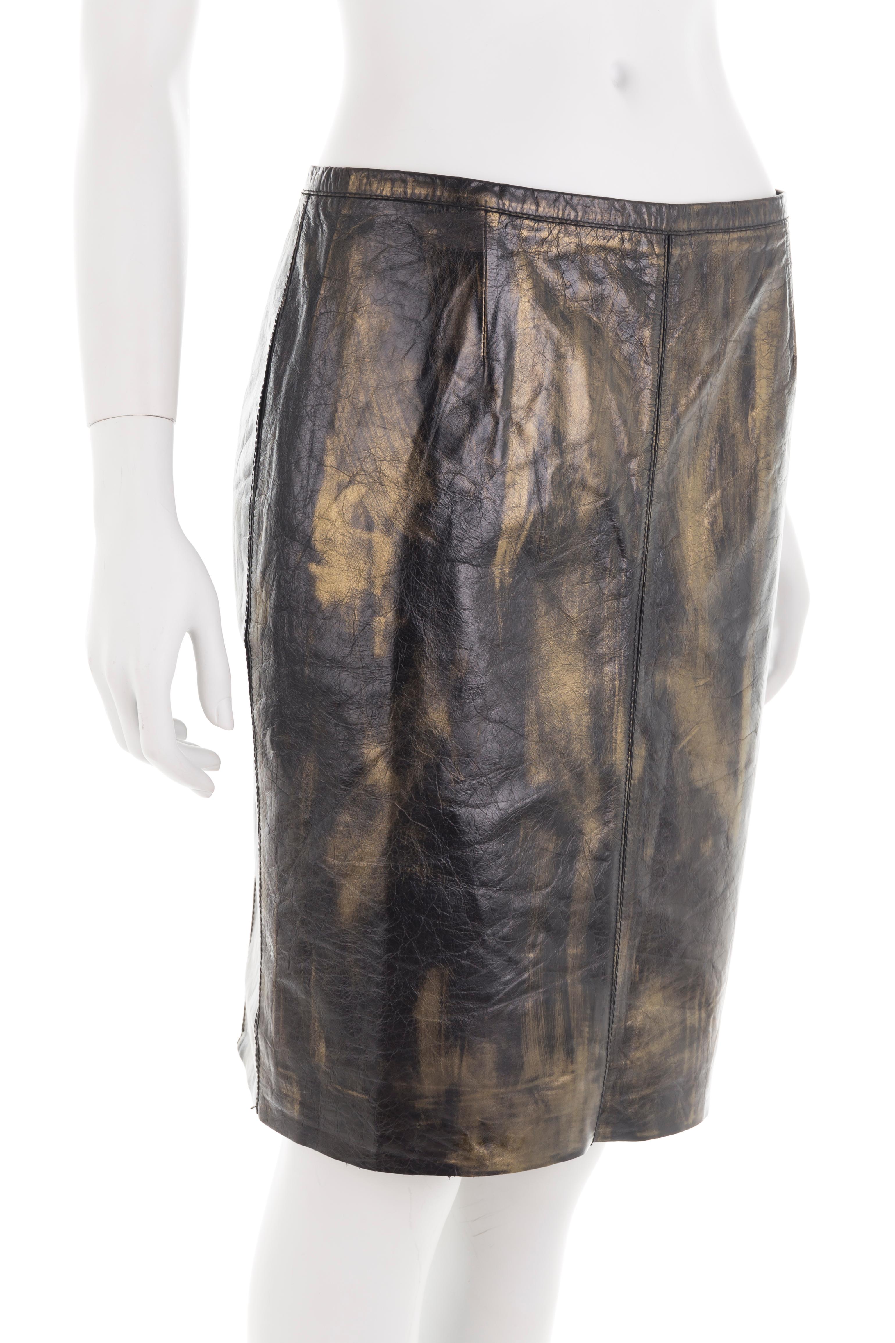 - Roberto Cavalli distressed leather skirt
- Sold by Gold Palms Vintage
- Spring/Summer 2001
- Brown leather with golden metallic hues
- Multi-paneled with mid tulle underlay
- Pencil fit
- Side zipper with hook
- Size S
