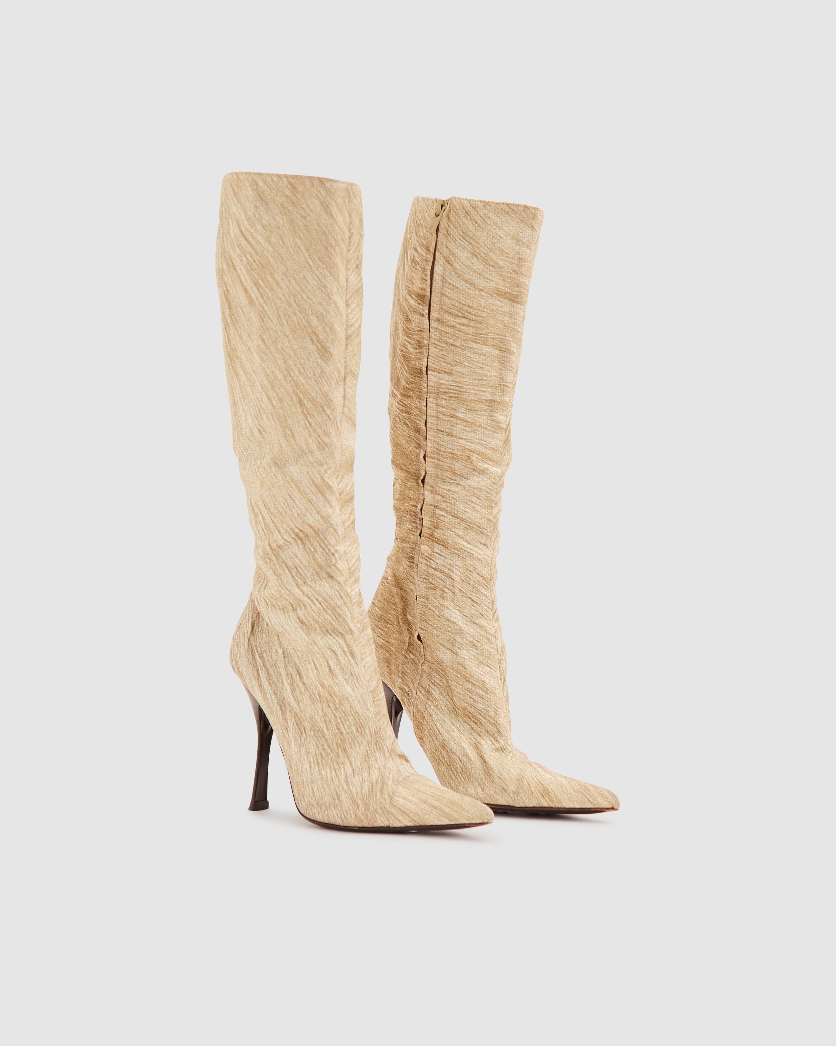 • Denim stiletto boots
• Calf-length
• Golden glittery fur print
• Leather lining