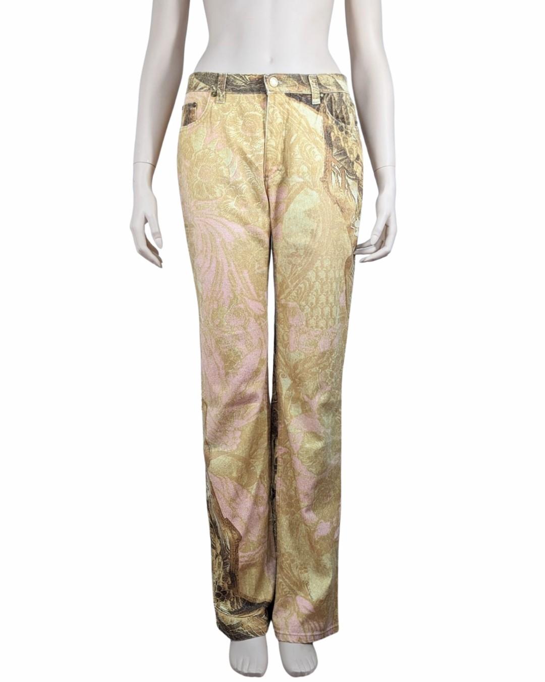 Roberto Cavalli F/W 2001 gold leaf pattern jeans with gold sparkles all around.

. Middle rise waist
· Slightly flared jeans
· Gold floral pattern all-over
. Sparkles embellishment

Size Fits XS to M 36FR
Tag size S but fits large as you can see on