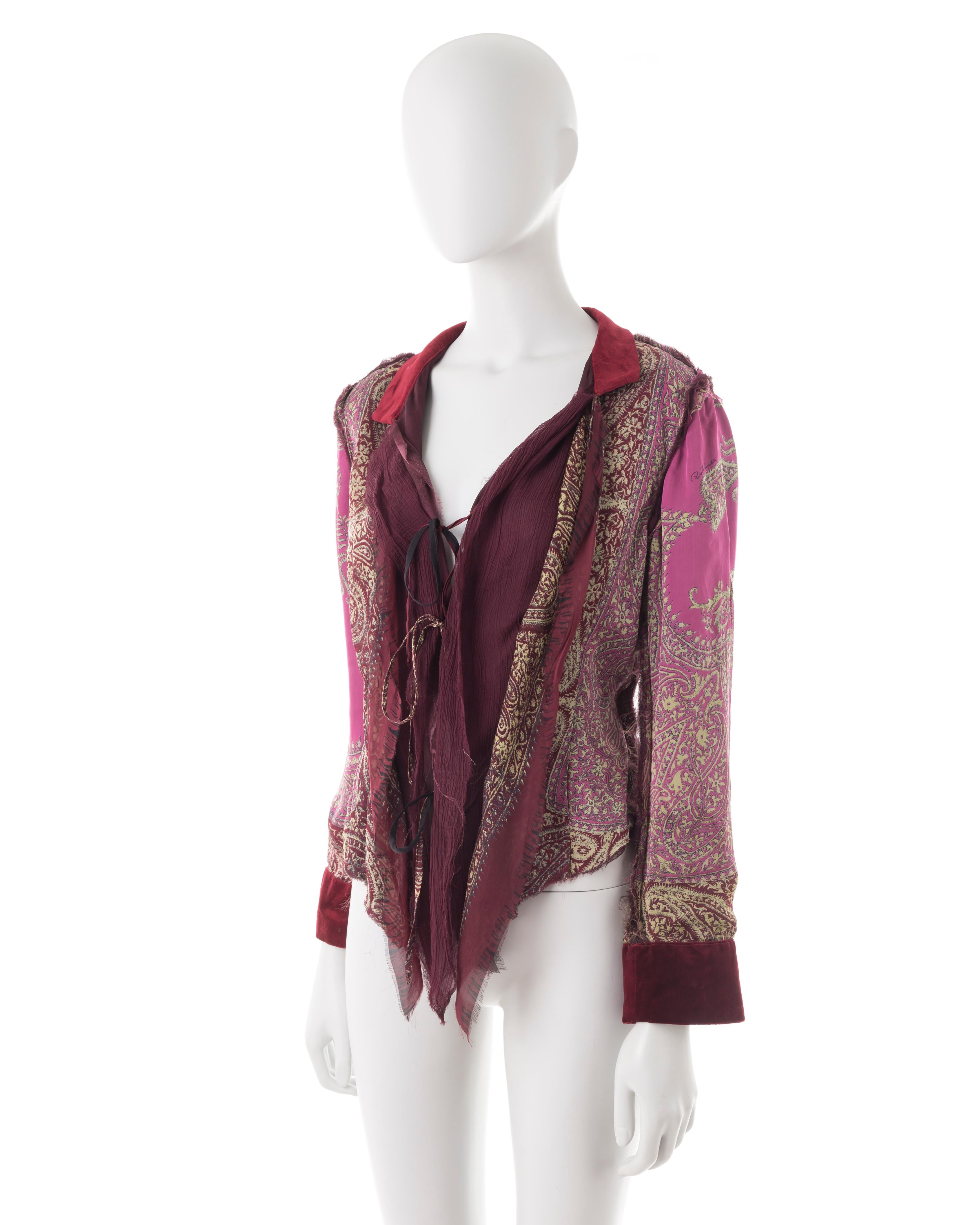 - Pink and maroon paisley silk blouse
- Maroon velvet cuffs and collar
- Shredded trimming
- Triple front tie fastenings
- Size M