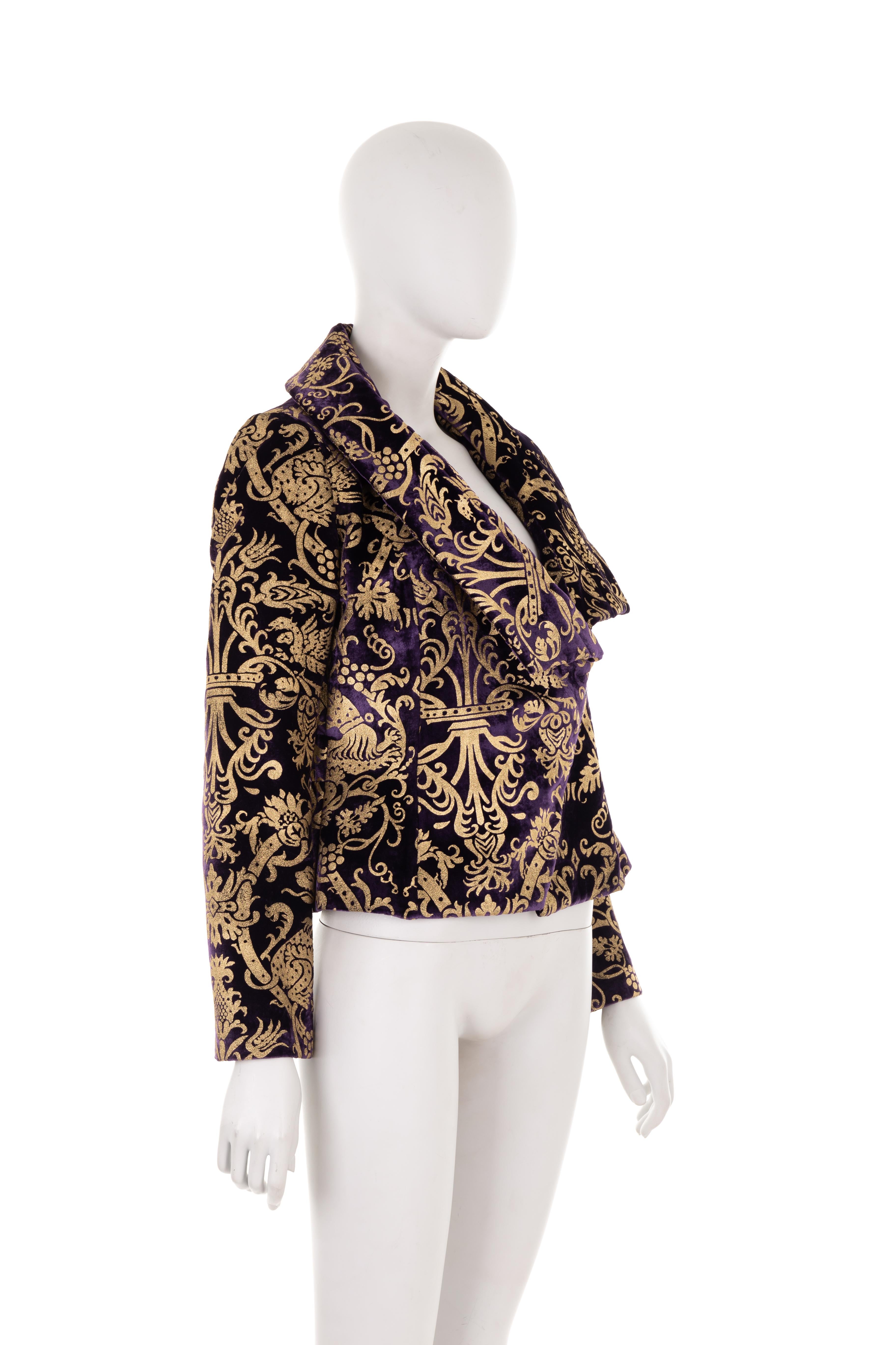 - Roberto Cavalli Fall Winter 2006 collection
- Sold by Gold Palms Vintage
- Purple velvet long sleeve jacket
- Asymmetric maxi collar
- Gold baroque motif
- Asymmetric front hook fastening with purple python detailing
- Cheetah print silk lining
-