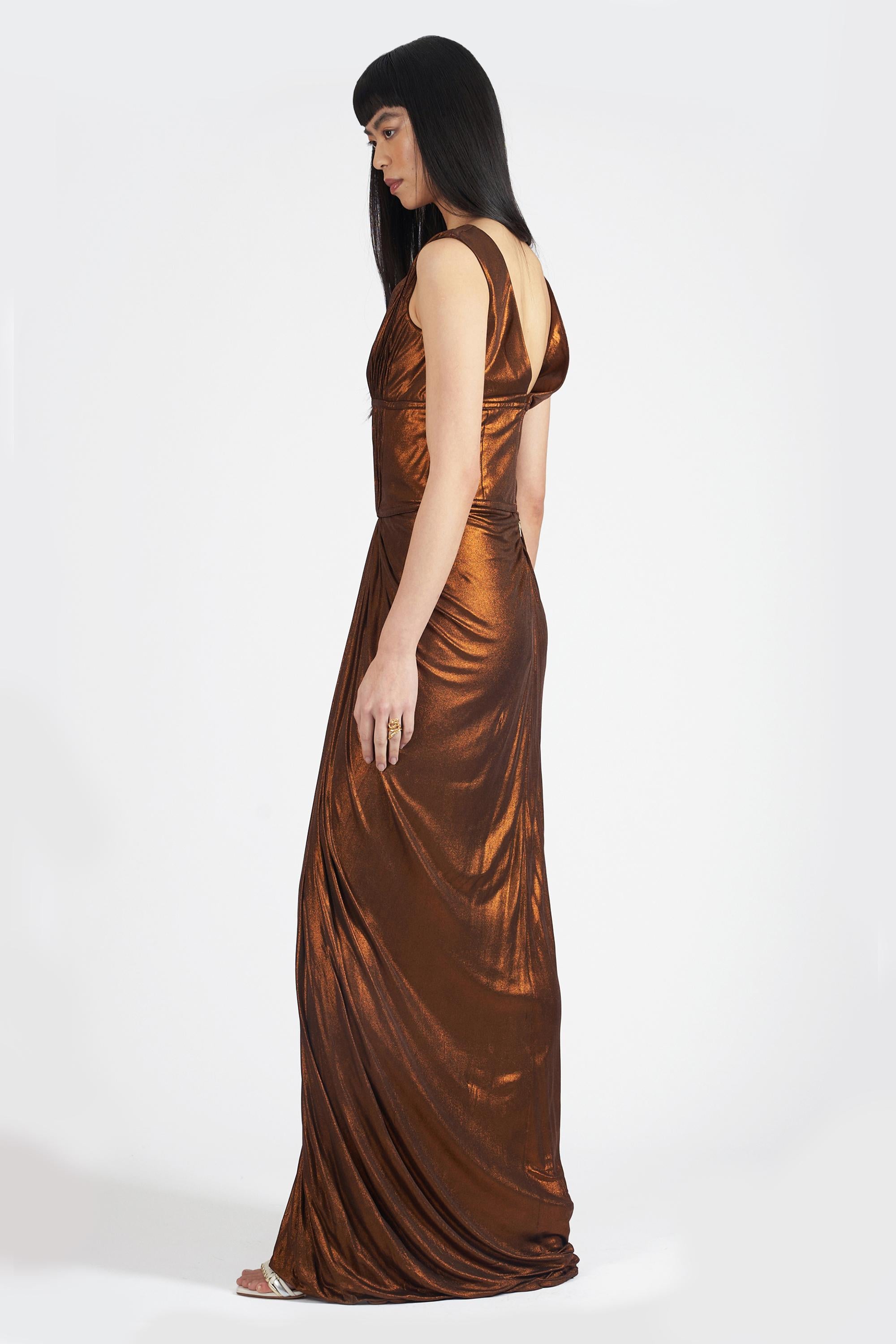 2007 Roberto Cavalli Fall Winter metallic gown. Features low cut neck, cut out detail, ruching detail, low back, zip closure and maxi length with tags. In great vintage condition, a few minor discolouration marks to the fabric.
Brand: Roberto