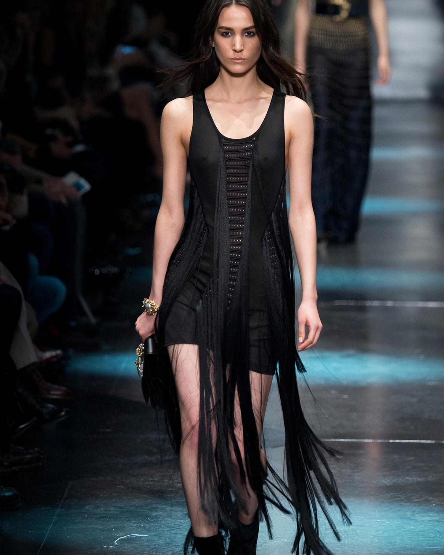 - Designed by Roberto Cavalli
- Sold by Skof.Archive
- Fall/Winter 2015 Collection
- Black cut-out fringe dress
- Runway piece
- Sleeveless design with intricate cut-out details
- Long cascading fringe panels for a dramatic effect
- Excellent