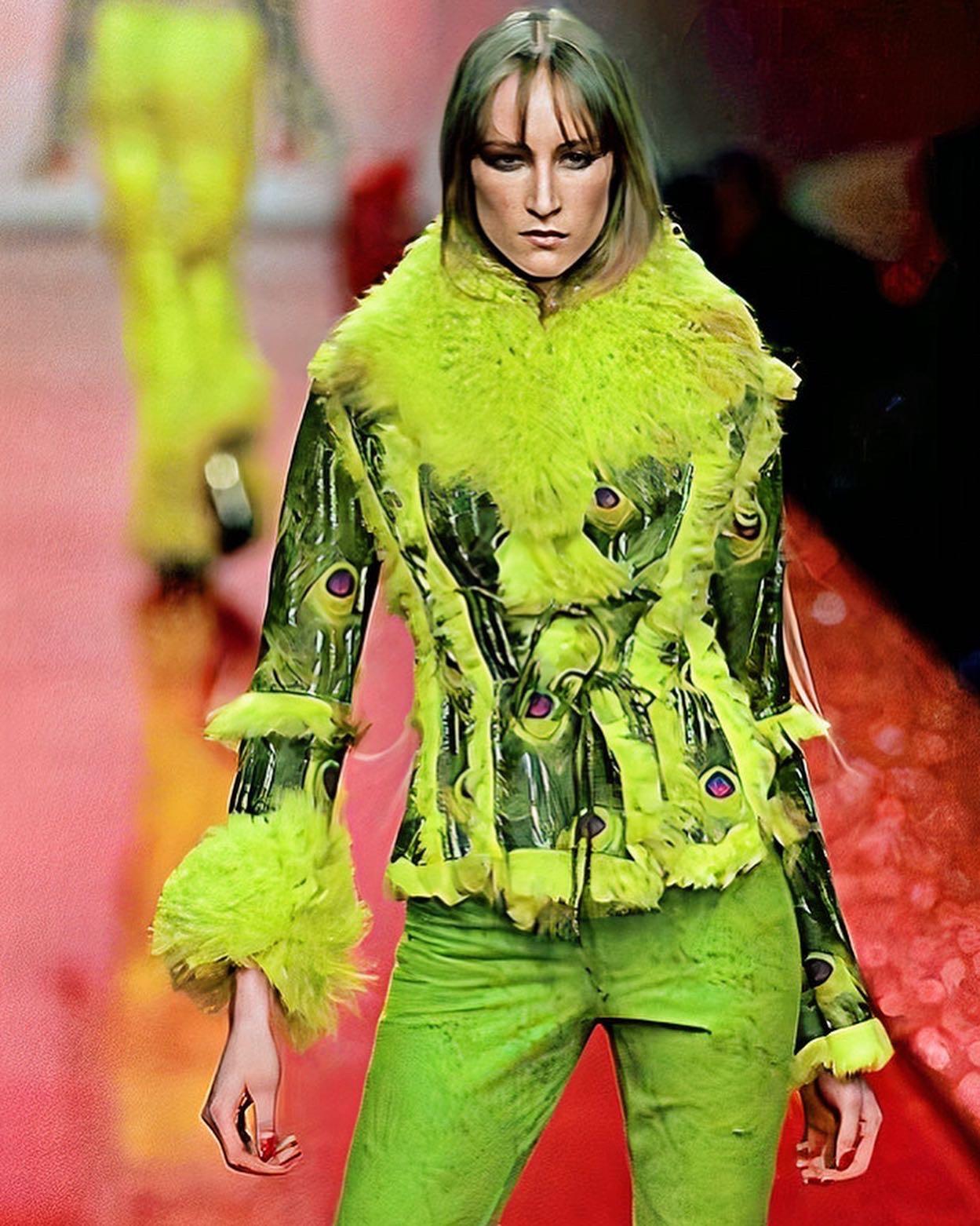 This fabulous vintage Roberto Cavalli shearling coat with bright hand painted leather with peacock print and long-haired neon fur is reversible and can be worn on both sides, for those who get bored of their wardrobe easily! 

The shearling coat was
