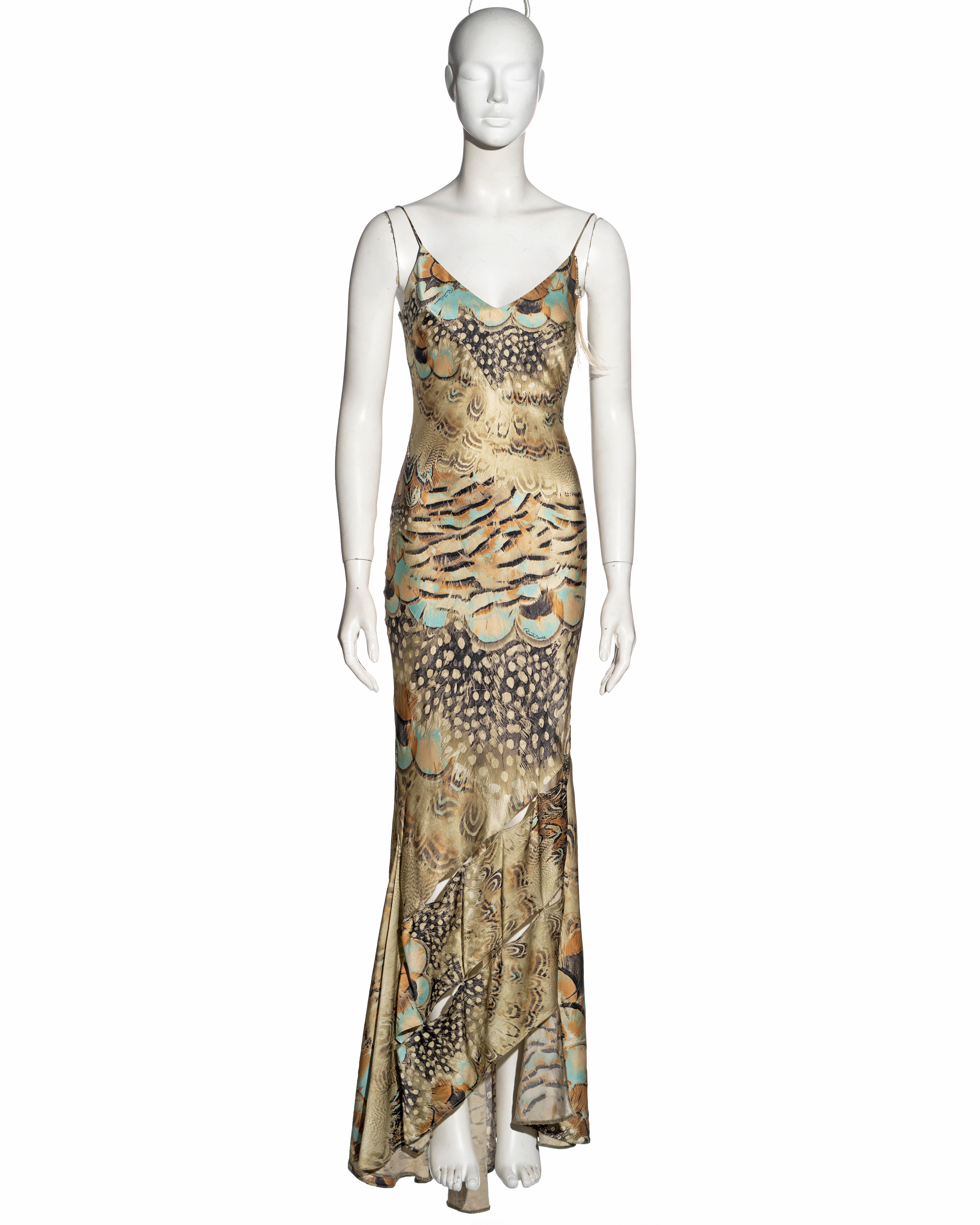 ▪ Roberto Cavalli evening dress
▪ Sold by One of a Kind Archive
▪ Constructed from bias-cut feather printed silk
▪ Matching large scarf which can be worn as a shawl or headscarf 
▪ The seams of the skirt have openings which bare the skin of the