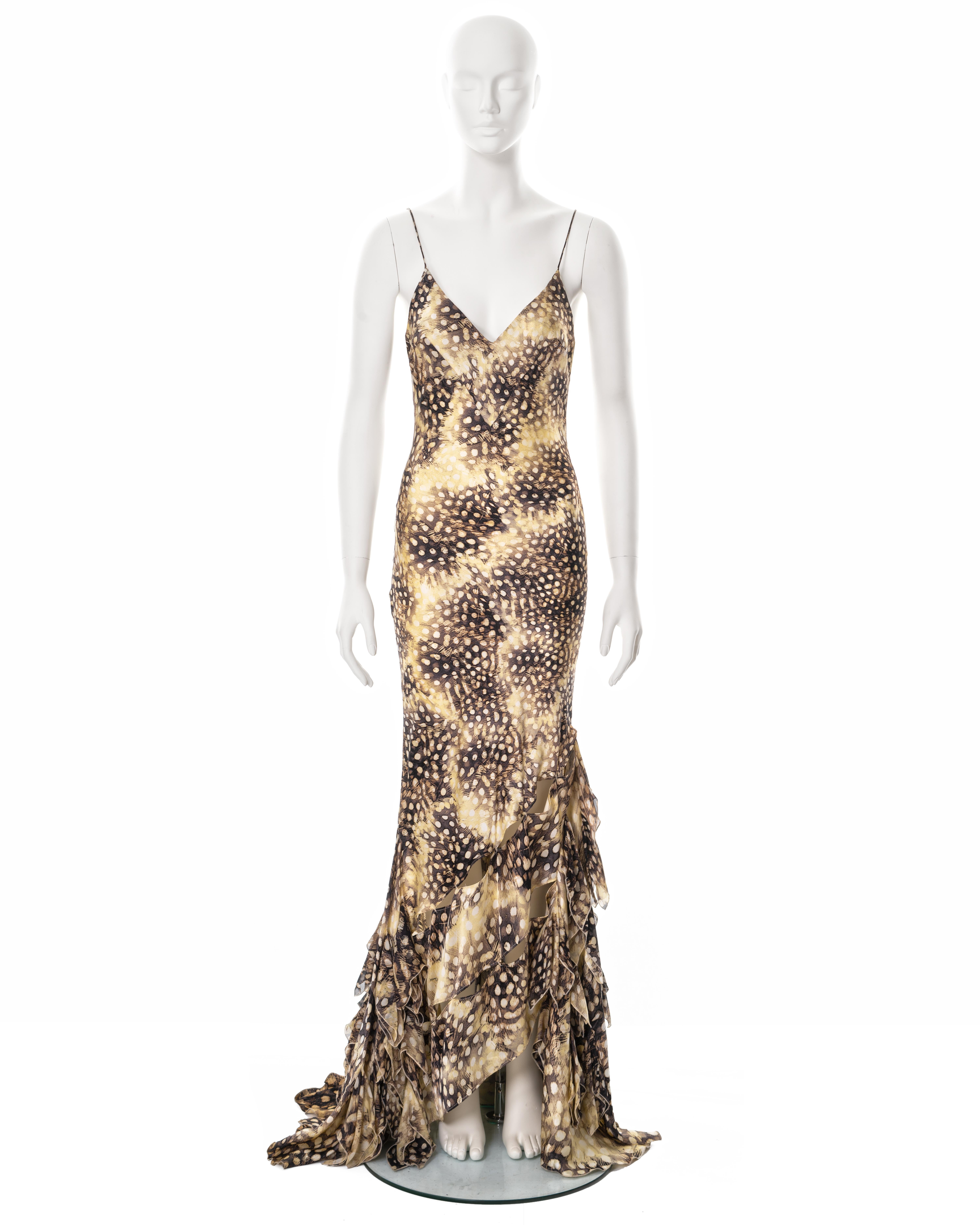 ▪ Roberto Cavalli evening dress
▪ Sold by One of a Kind Archive
▪ Spring-Summer 2004
▪ Constructed from feather-printed bias-cut silk 
▪ V-neck
▪ Spaghetti straps 
▪ Floor-length skirt with train 
▪ Multiple open seams on the skirt bare the skin of