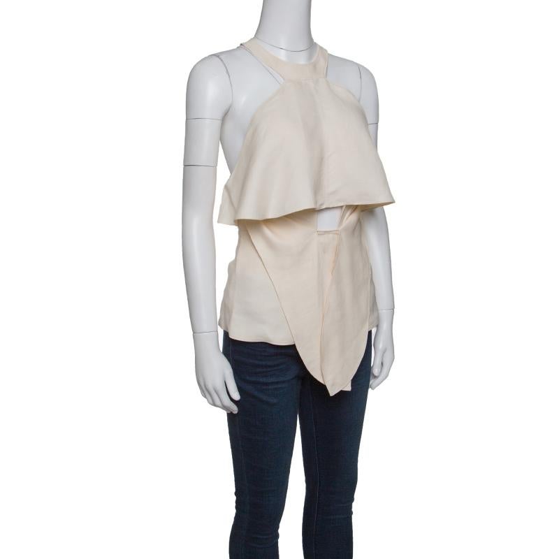 Look every part the fashionista you are in this Roberto Cavalli top that was created from the finest blend of linen. Designed as a sleeveless with ruffles, a tie and cutout at the front as well as a zipper on the racer back, this beige top is